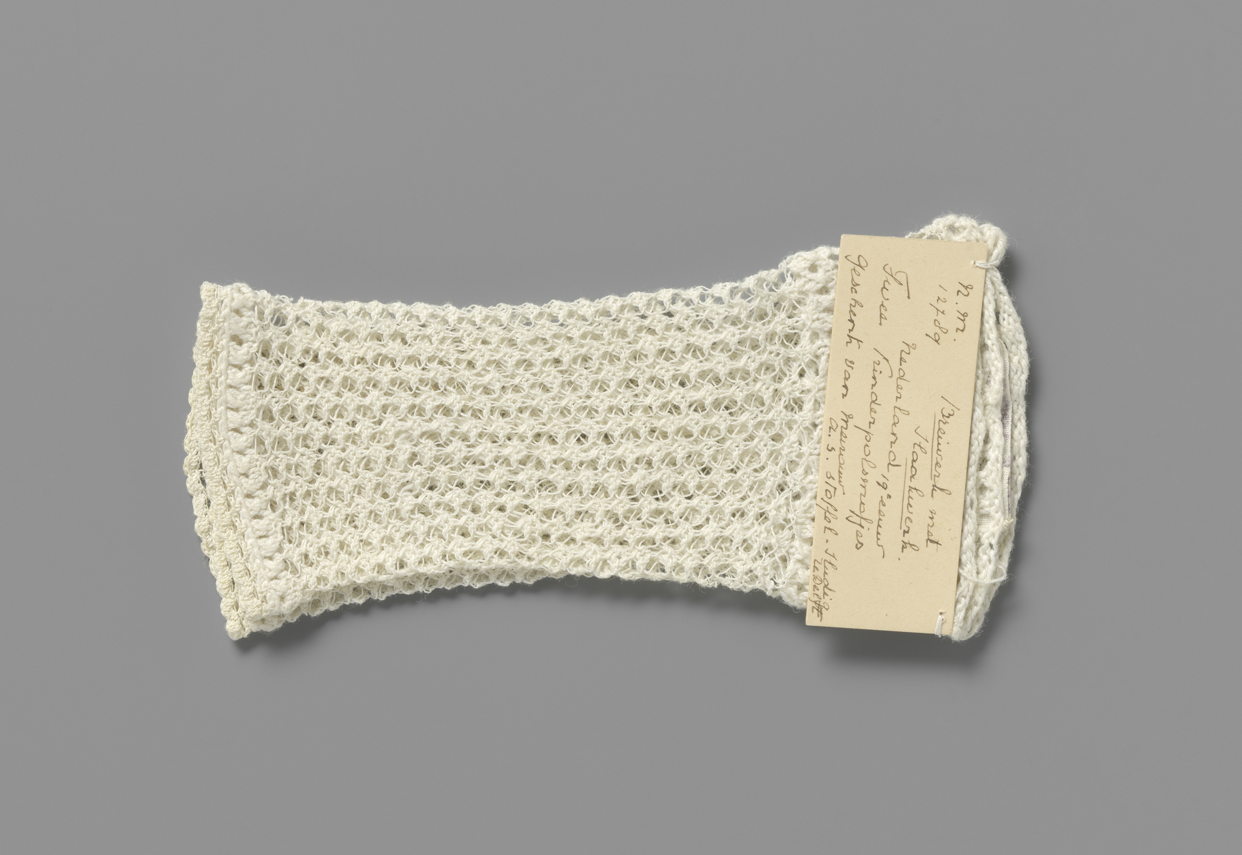 Victorian textile glove with lacework by Unknown Artist