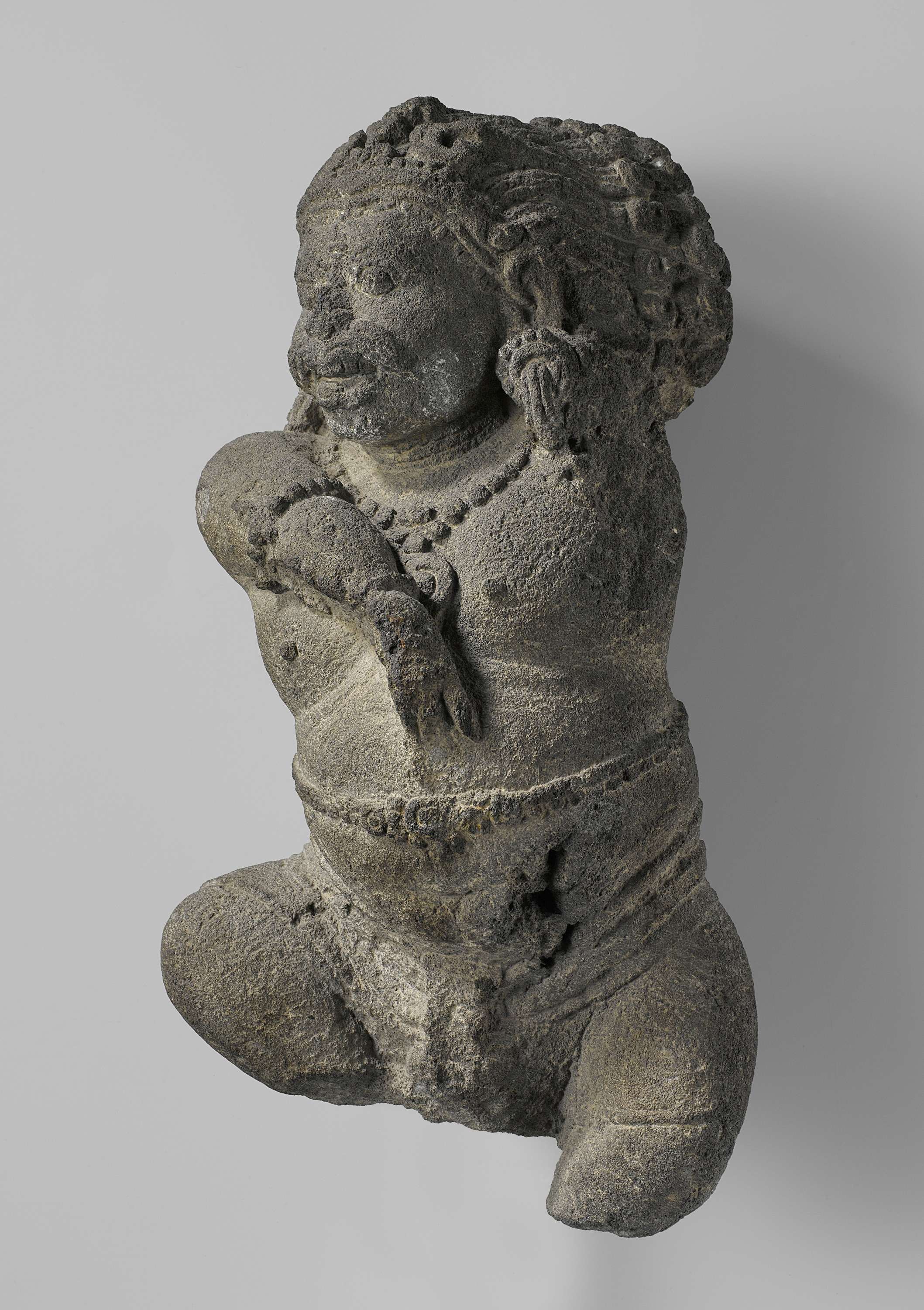 Sculpture of a demonic figure in an active pose by Unknown Artist