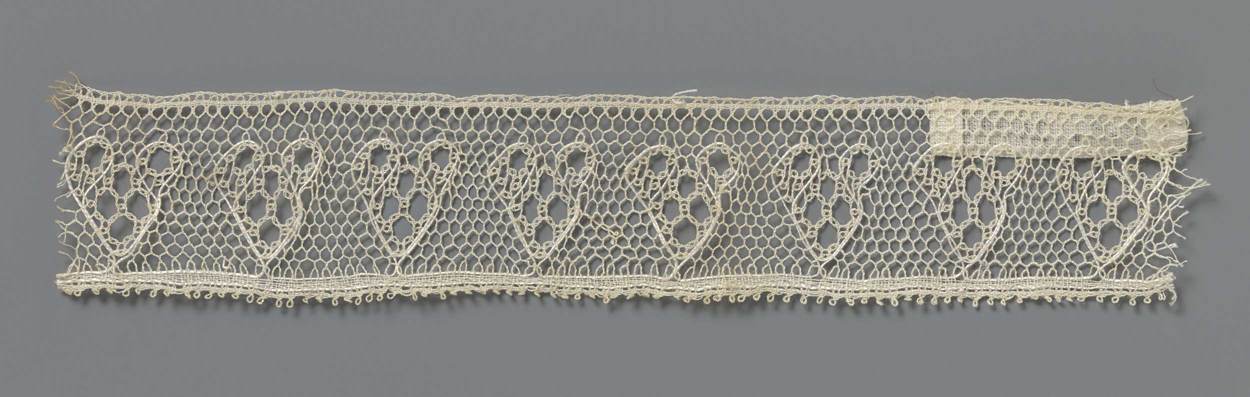 Intricate lace piece with heart shapes, created by Unknown Artist