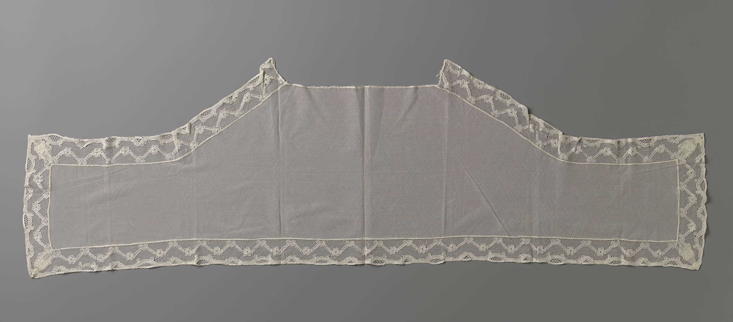 Lace shawl with intricate borders, crafted by Unknown Artist.