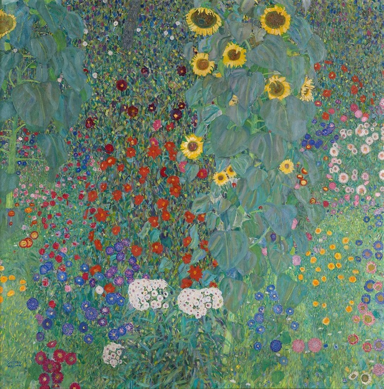 A colorful cottage garden filled with sunflowers and lush greenery.