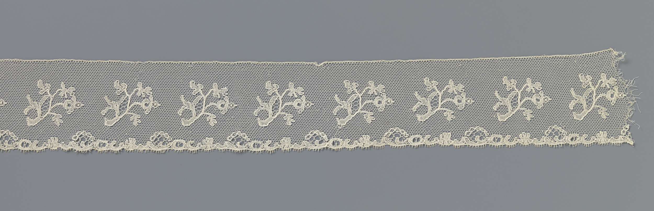 Lace artwork featuring S-shaped branches by Unknown Artist