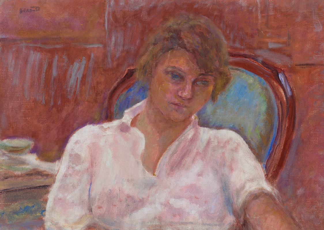 A young woman daydreams in a pink-hued armchair, surrounded by a vibrant interior.