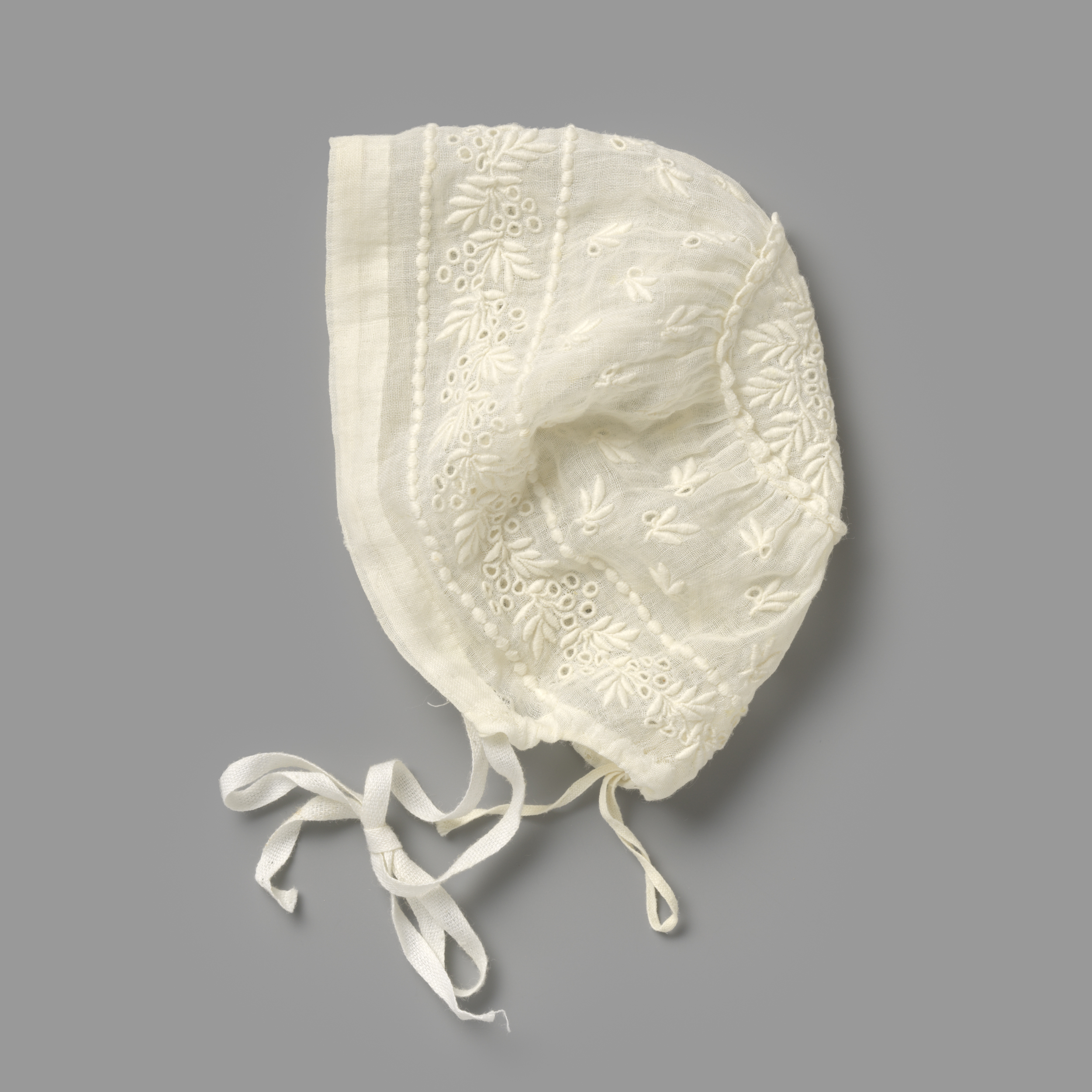 Textile piece by Unknown Artist featuring delicate embroidery with leaves and tendrils