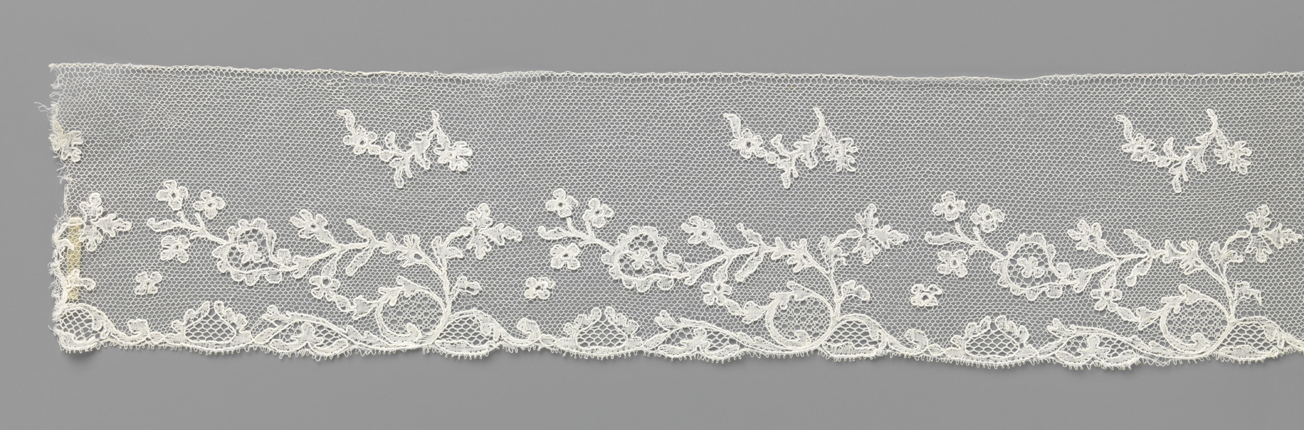 Lace artwork featuring a heart-shaped flower by Unknown Artist