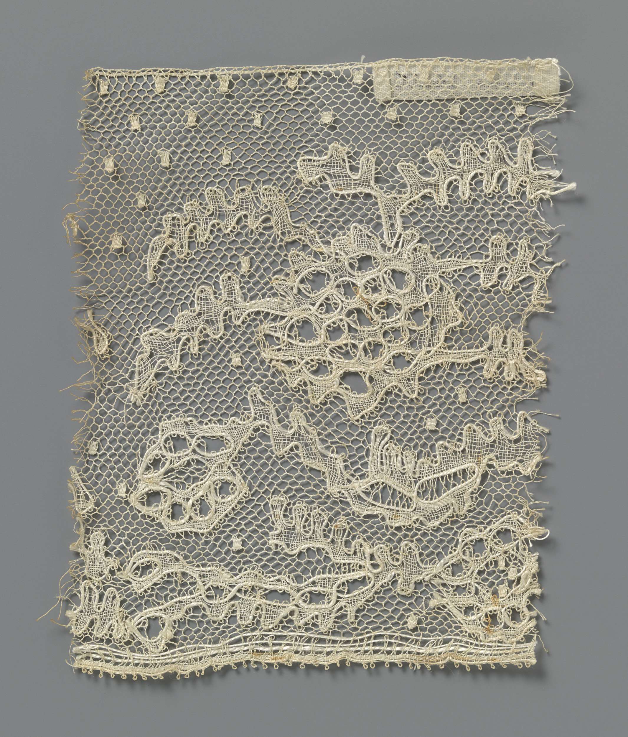 Intricate lace piece by Unknown Artist, featuring floral patterns and delicate textures.