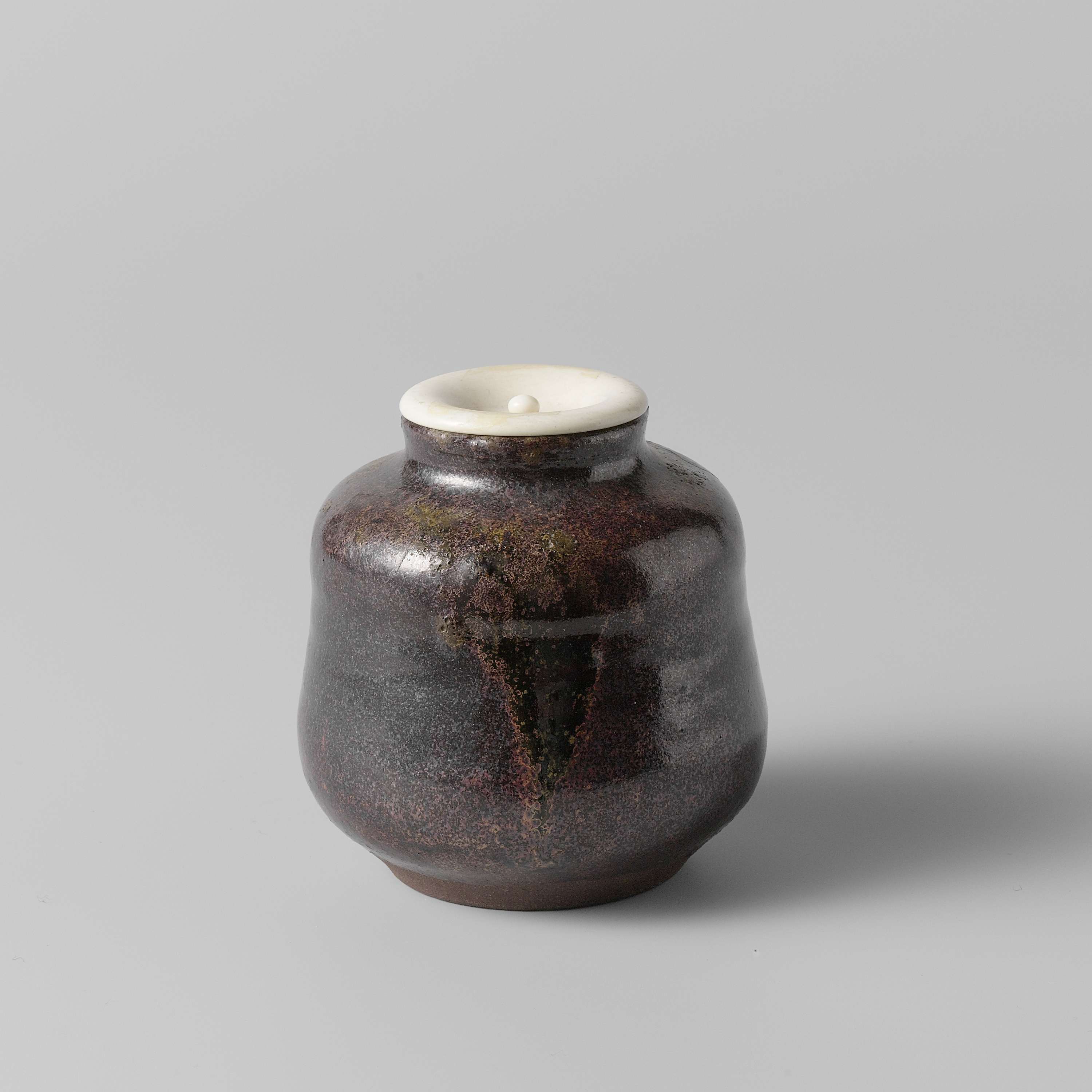 Tea caddy with a purple glaze by Unknown Artist, showcasing vibrant ceramic craftsmanship.