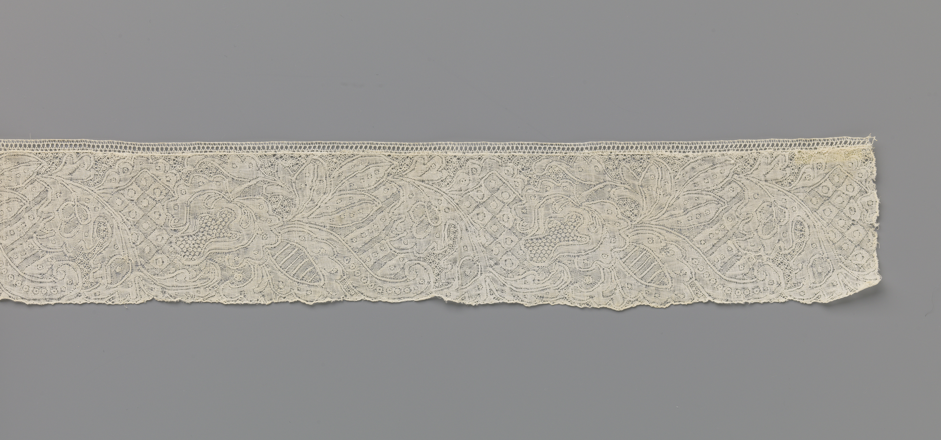 Lace textile design featuring a hanging pear-shaped flower by Unknown Artist.