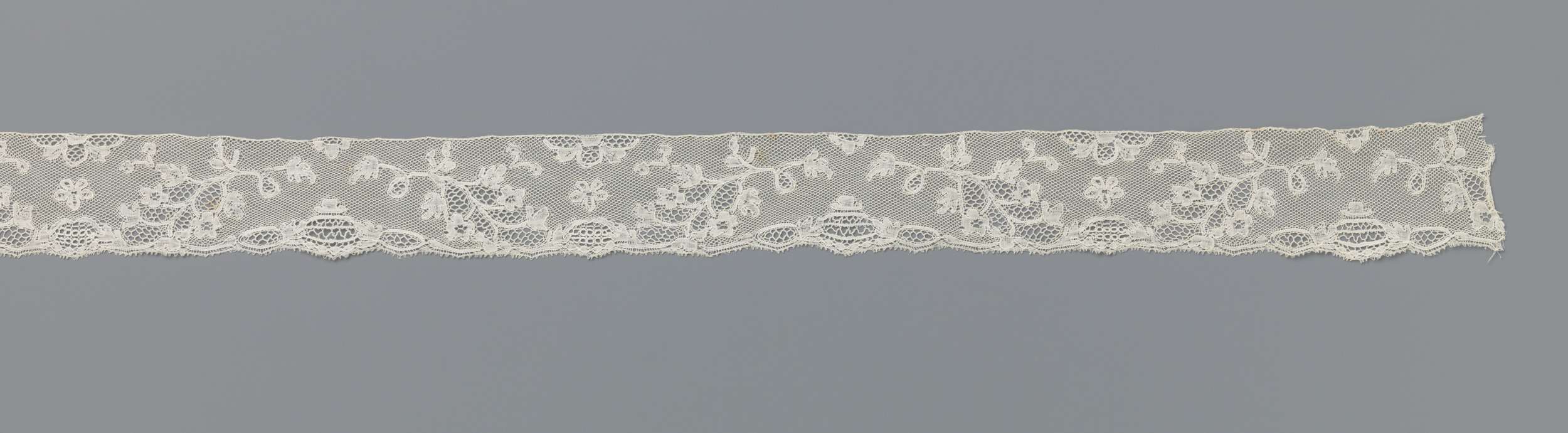 Intricate lacework featuring branches by Unknown Artist
