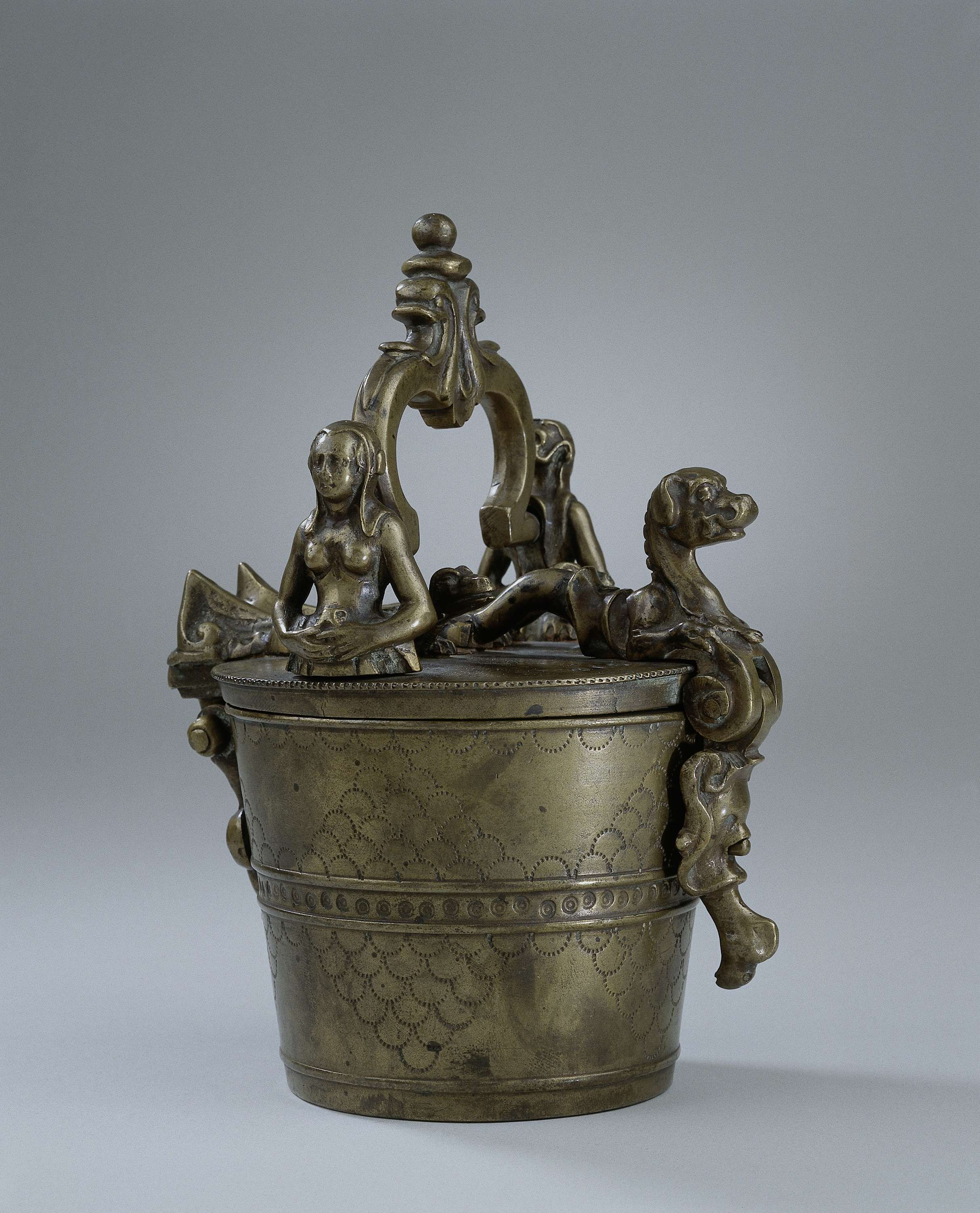 Set of Nested Cup Weights in bronze by Guilliam de Neve, featuring intricate auricular style design.