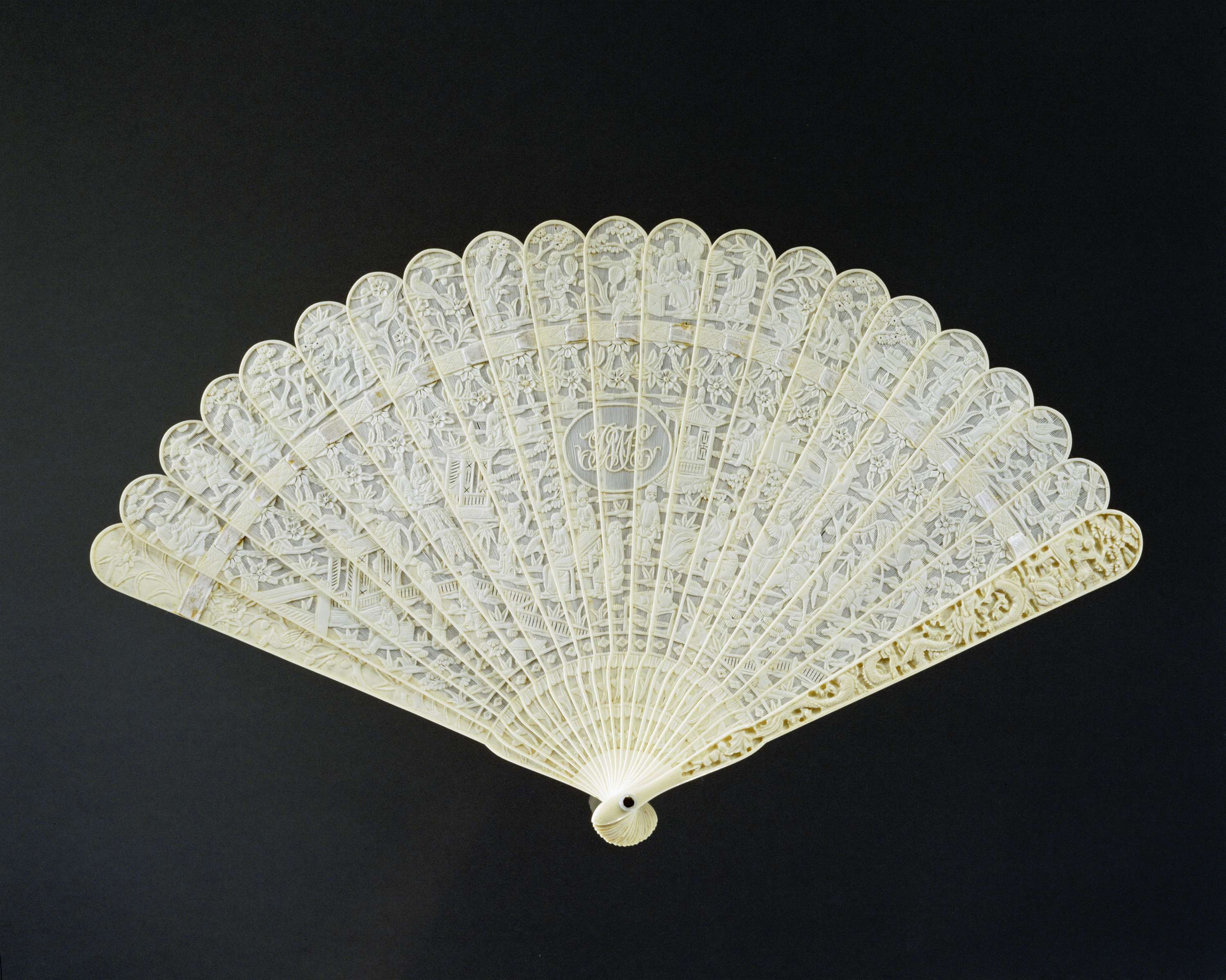 Intricate ivory fan with Chinese scenes, carved by Unknown Artist