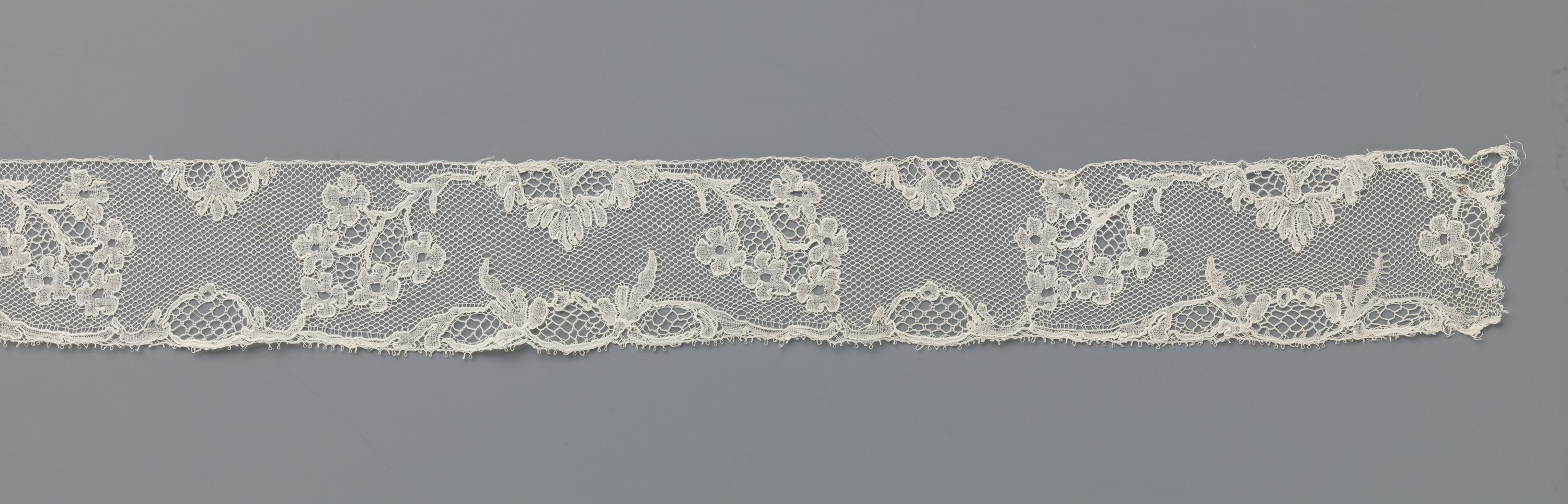 Lace work by Unknown Artist, c. 1750, showcasing intricate floral patterns.