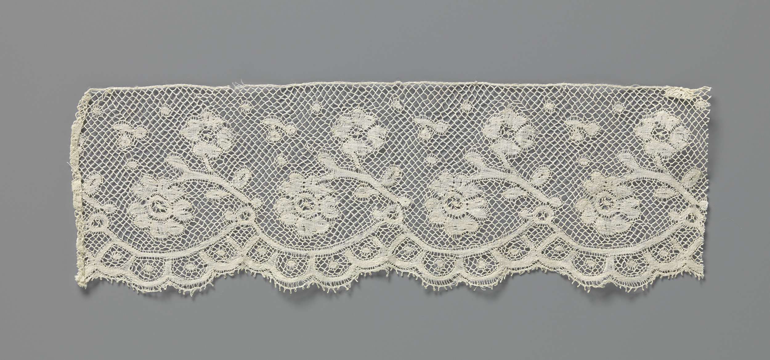Lace artwork featuring flowers by an unknown artist