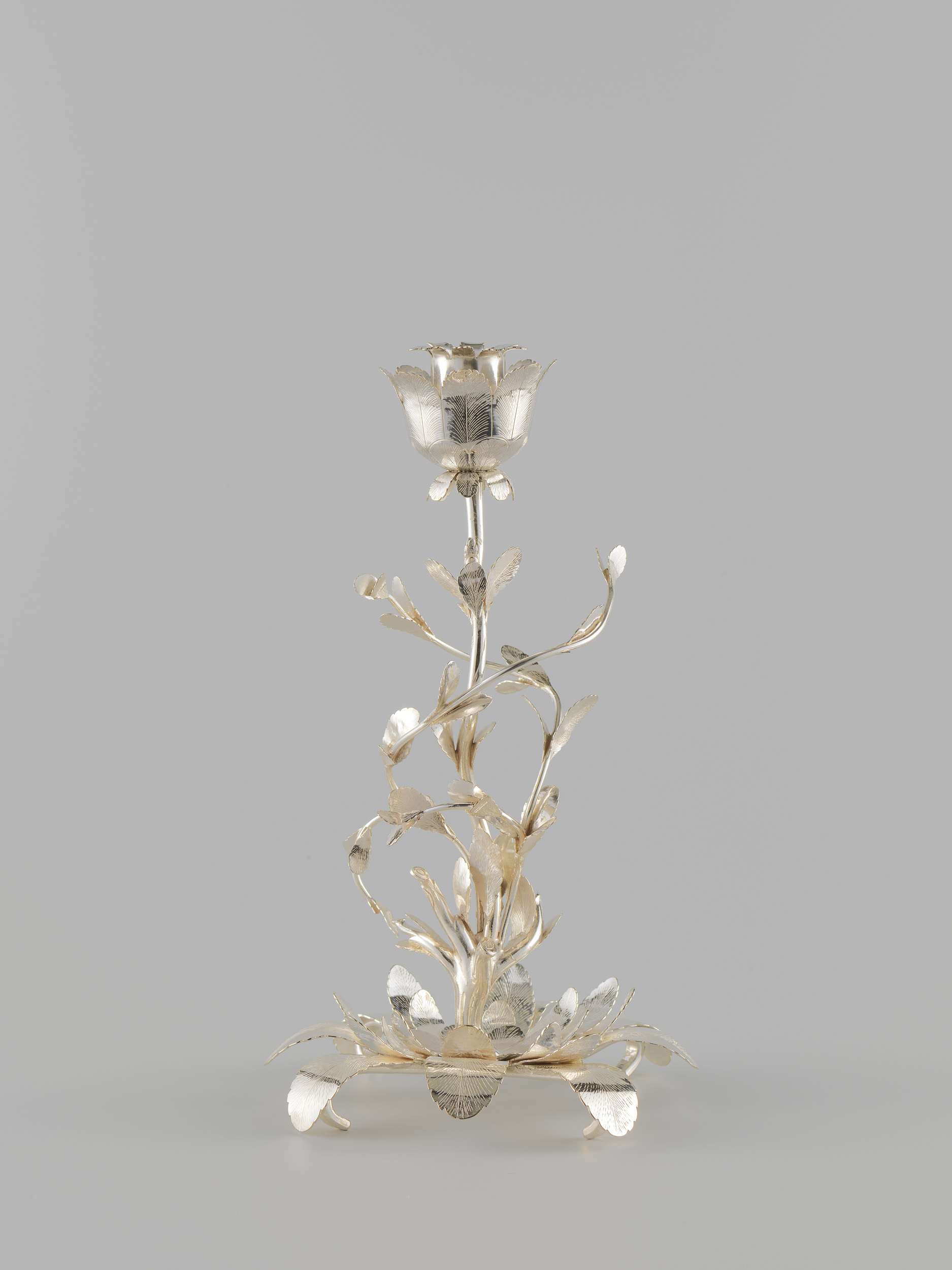 Silver candlestick by Jan Kemaer, 1784, featuring a twisted trunk and ornate branches.