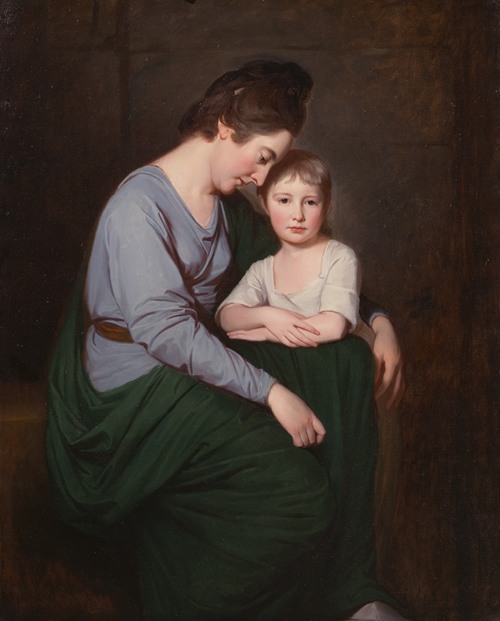 A mother and daughter pose together, with the mother wearing a dark dress and the daughter in a light gown.
