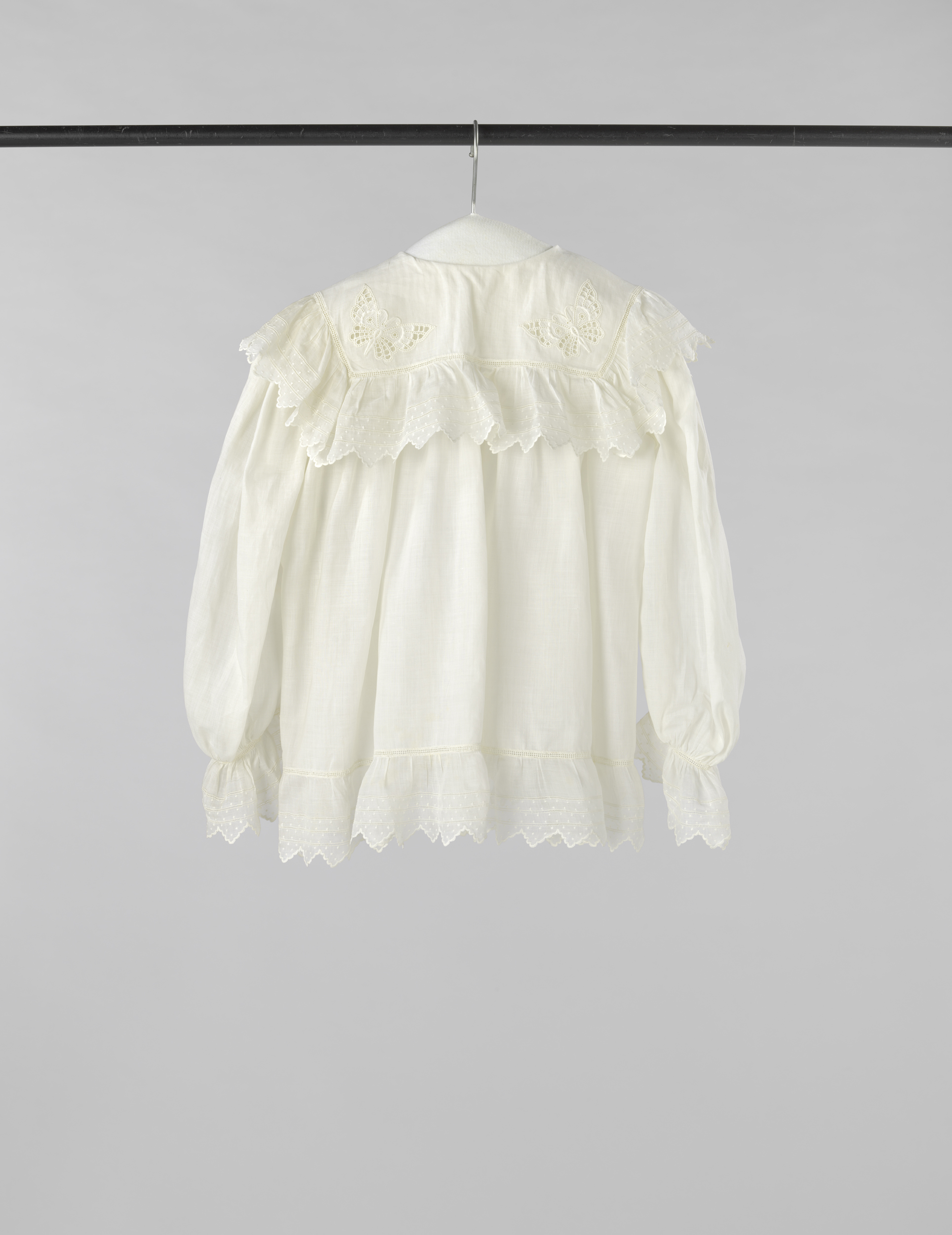 Decorative art featuring embroidered butterflies on fine batist by Fa. Philippona Ketelaar