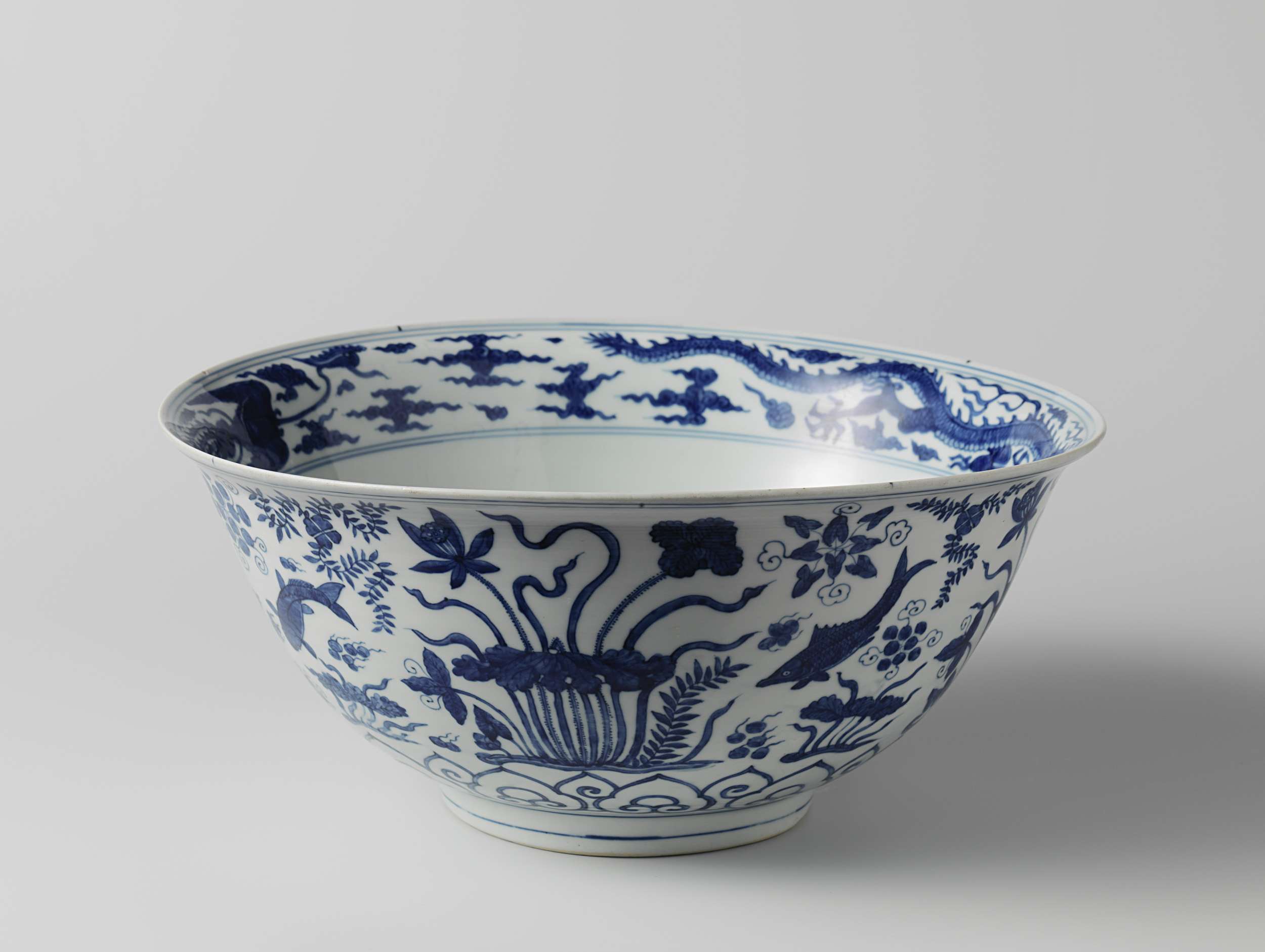 Ceramic bowl featuring fenghuang, dragons, and water plants by Unknown Artist