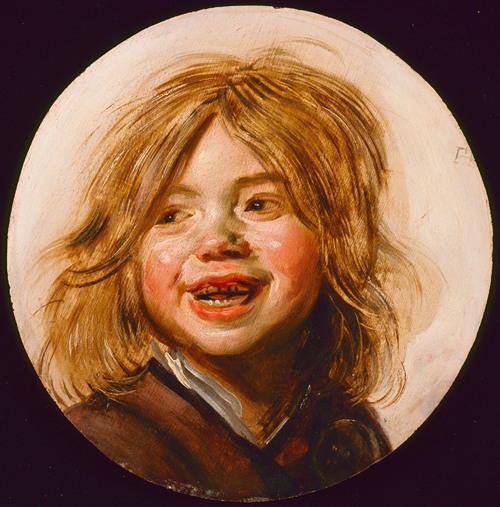 A joyful child laughing in a vibrant setting.