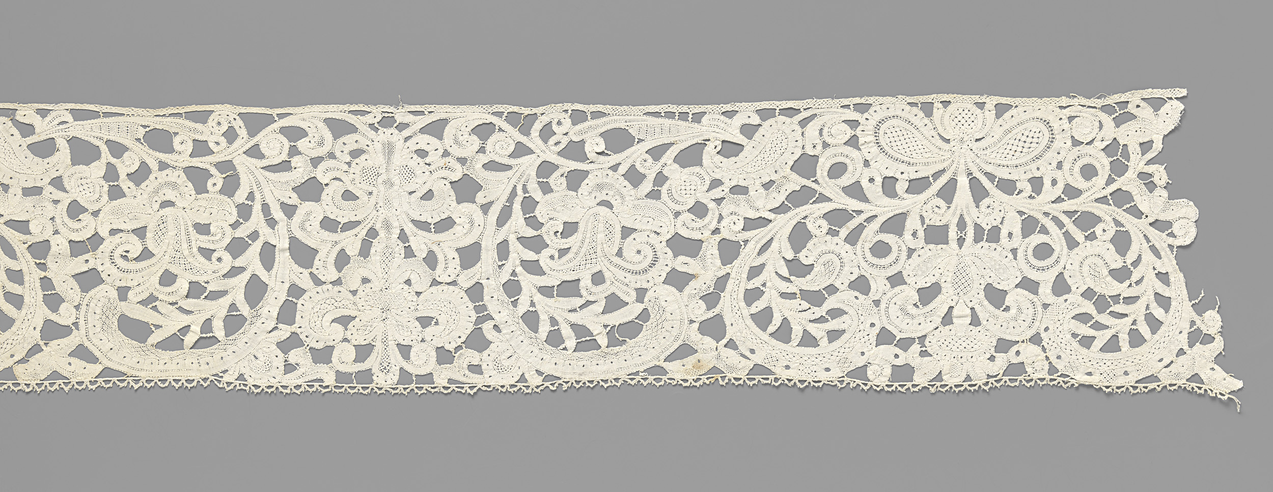 Lace work featuring candelabra motifs and curling leaves by Unknown Artist