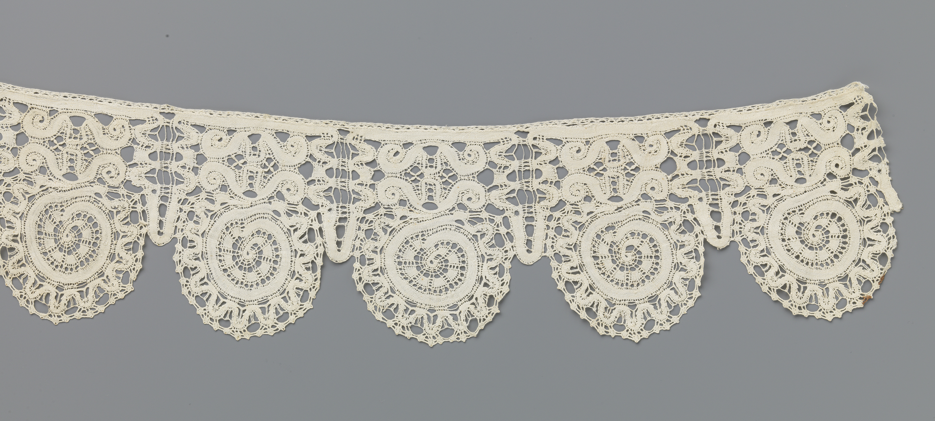 Intricate lace work featuring spirals and mirrored volutes by Unknown Artist