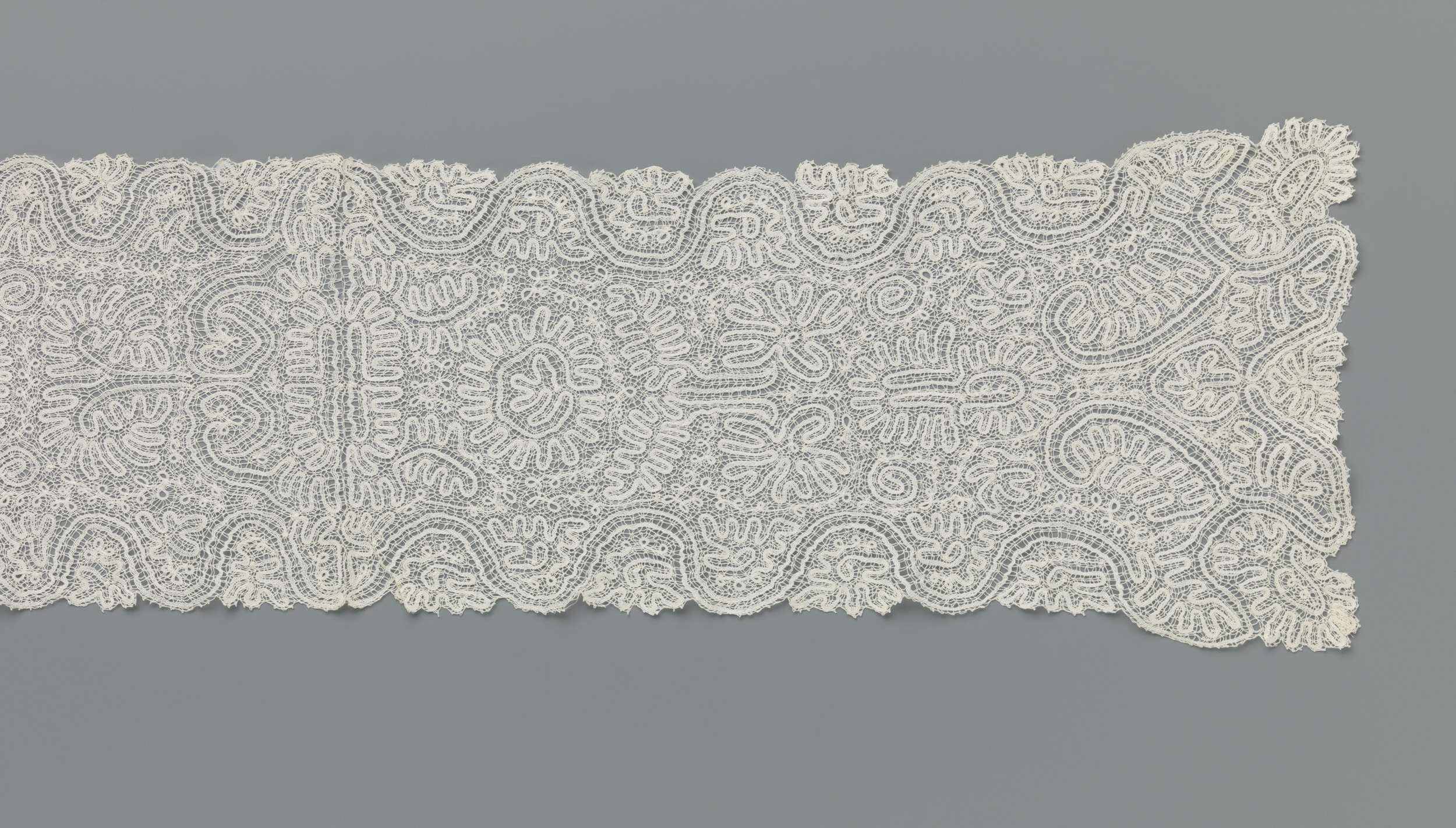 Lace shawl by Unknown Artist, showcasing intricate patterns and craftsmanship.