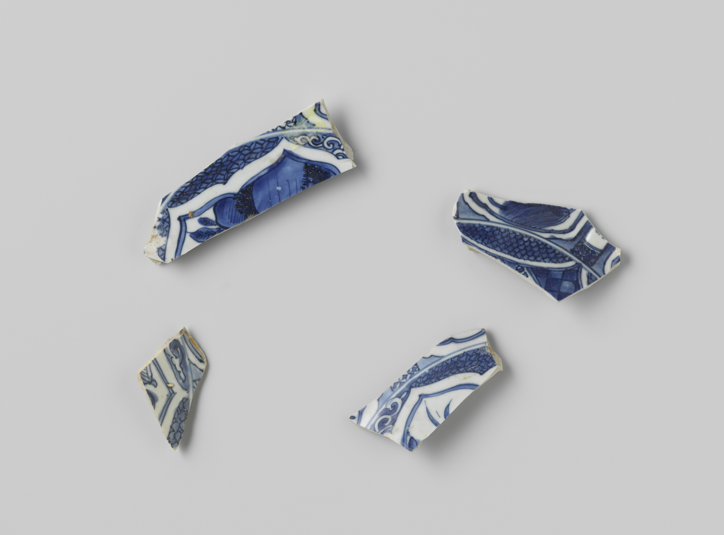 Fragments of a ship's plates from the V.O.C. ship Witte Leeuw, made of bone by Unknown Artist.