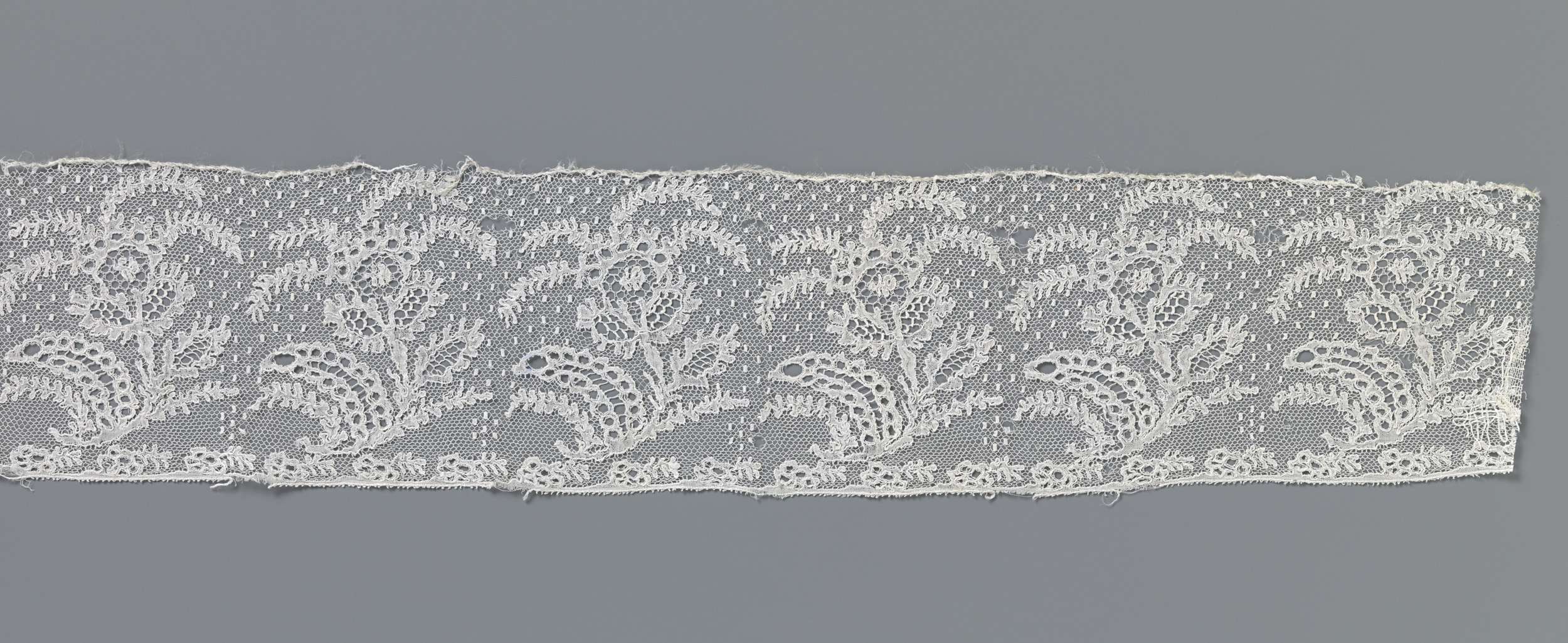 Lace work featuring floral motifs and feathery plumes by Unknown Artist