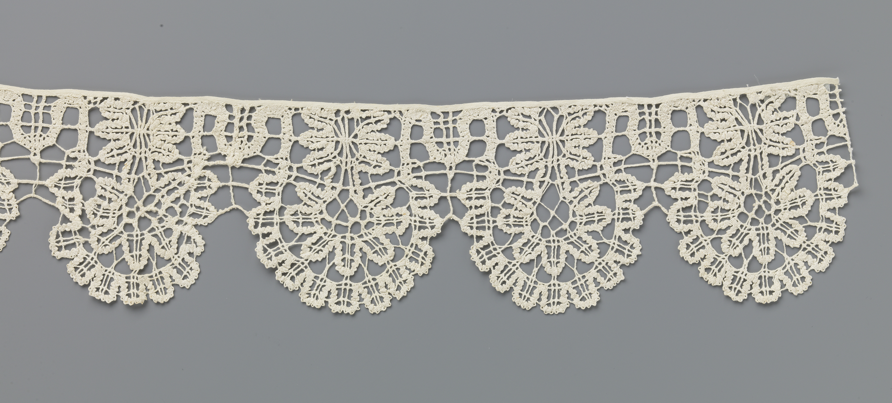 Lace textile featuring a seven-lobed flower by Unknown Artist