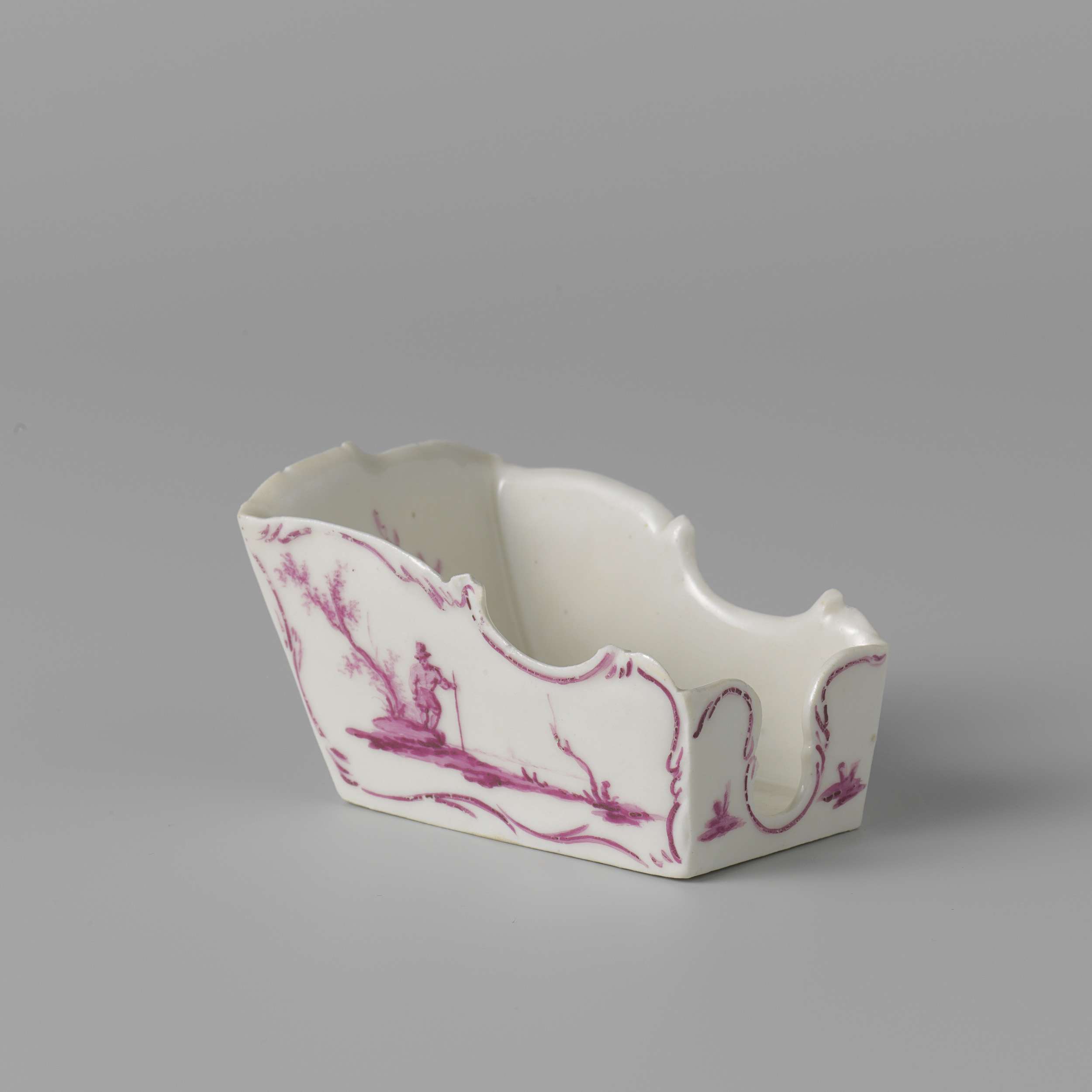 Two pipe rests in porcelain by Manufacture Oud-Loosdrecht, featuring delicate ornamentation.