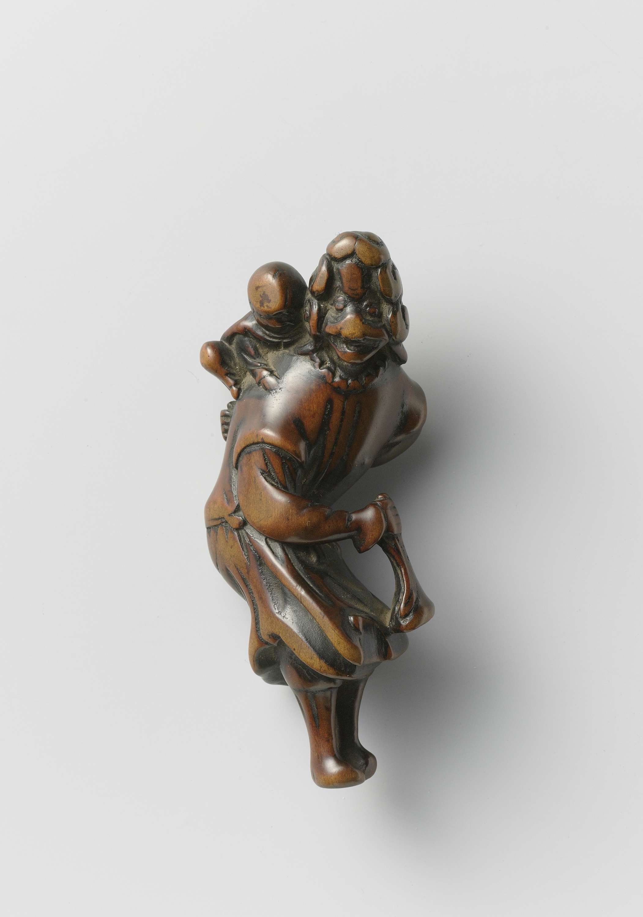 Netsuke in the form of a Dutch woman with a child, by Unknown Artist, public domain