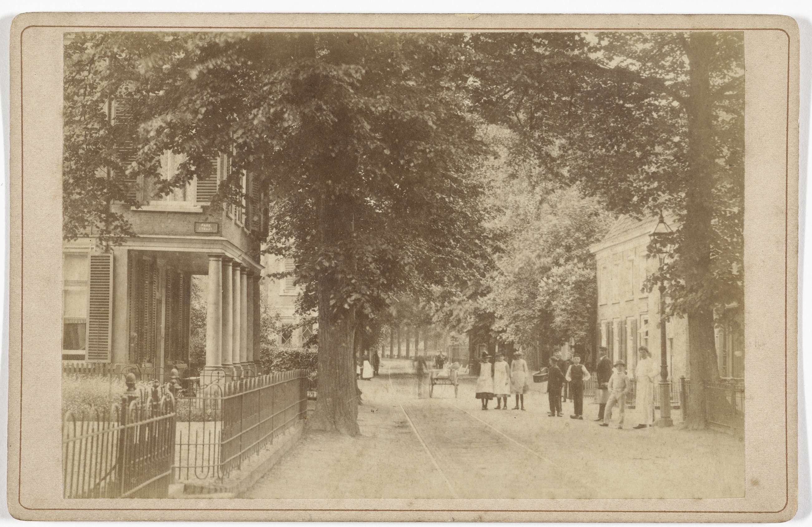 A group of figures in a village street, albumen print by J.S.J. de Jongh