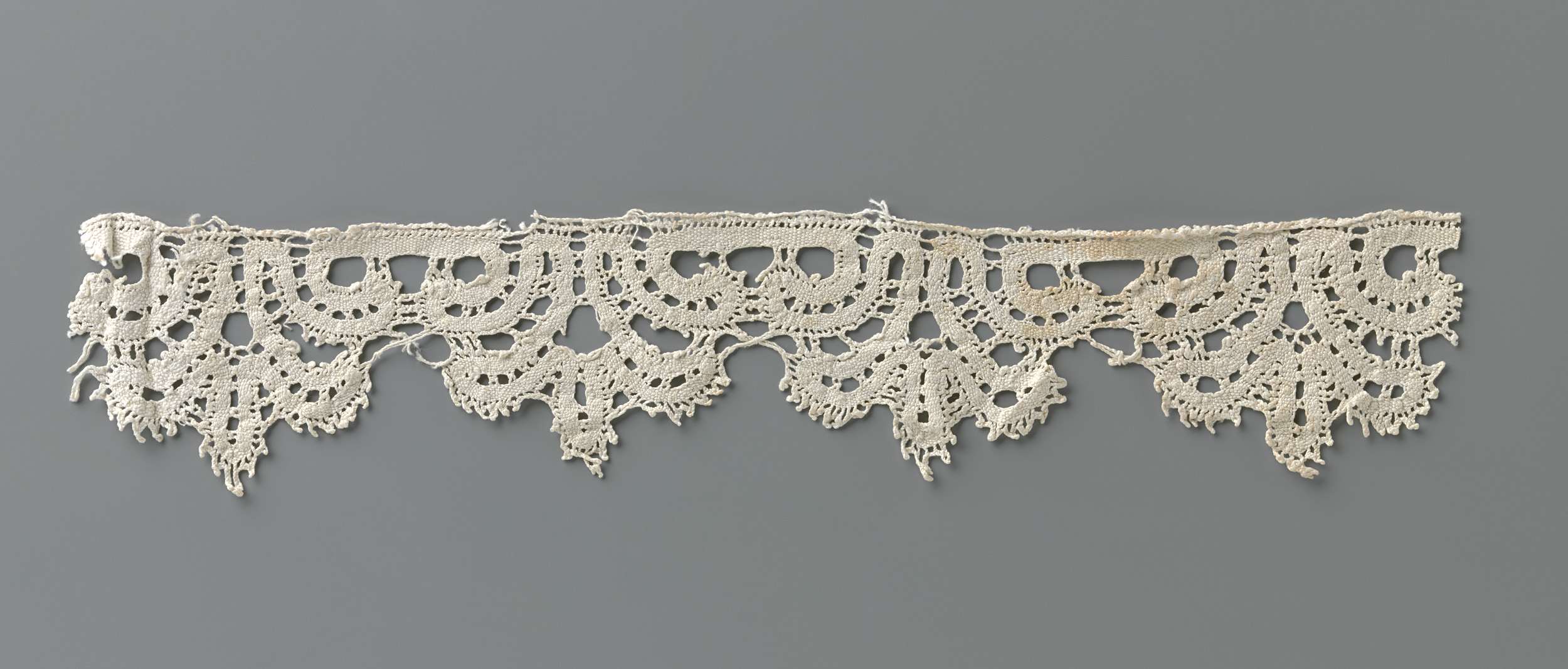 Delicate lacework by Unknown Artist, medium lace, featuring intricate 17th-century Italian motifs.