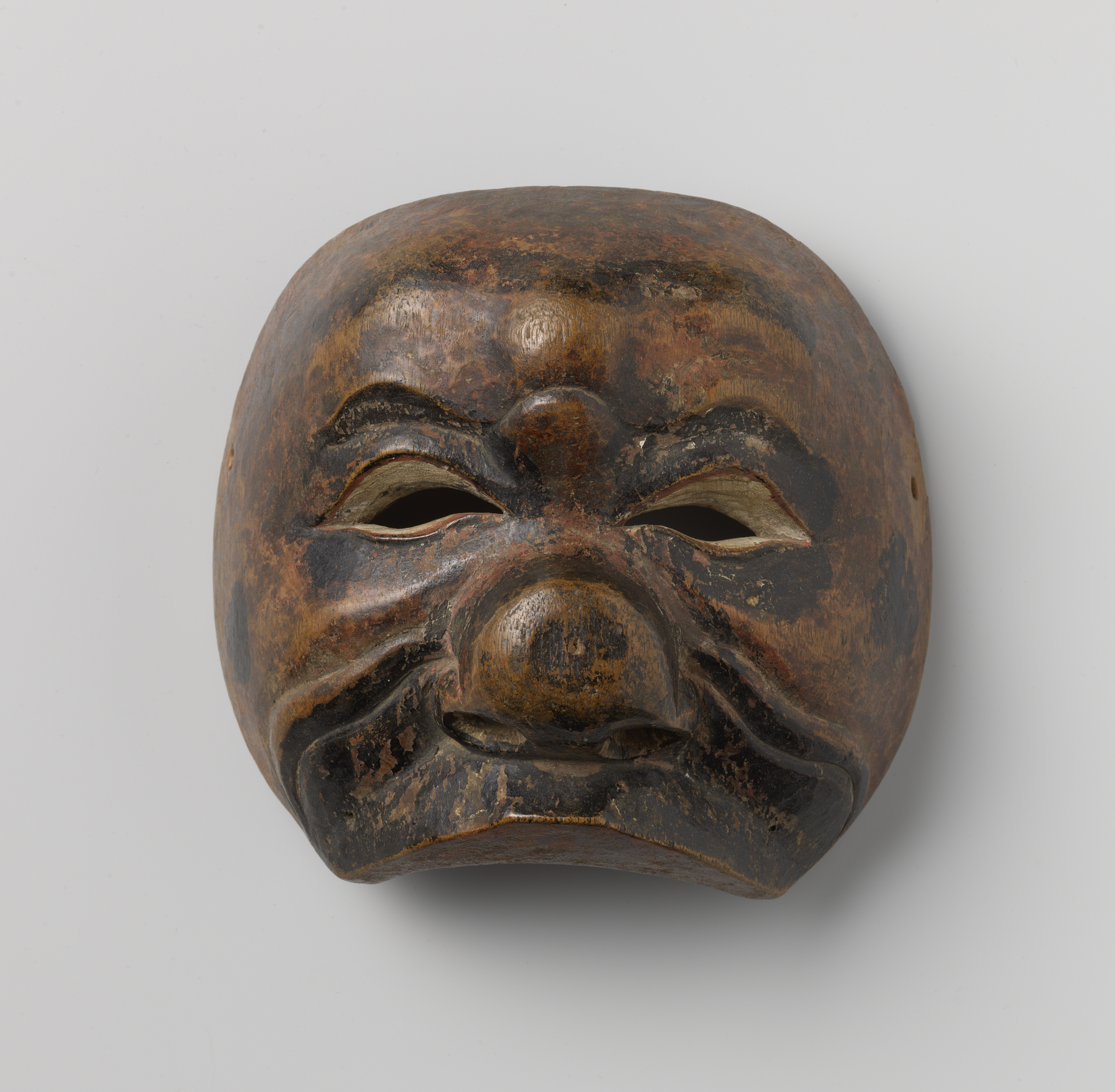 Figurative wood sculpture by Unknown Artist featuring a masked figure with intricate patterns.