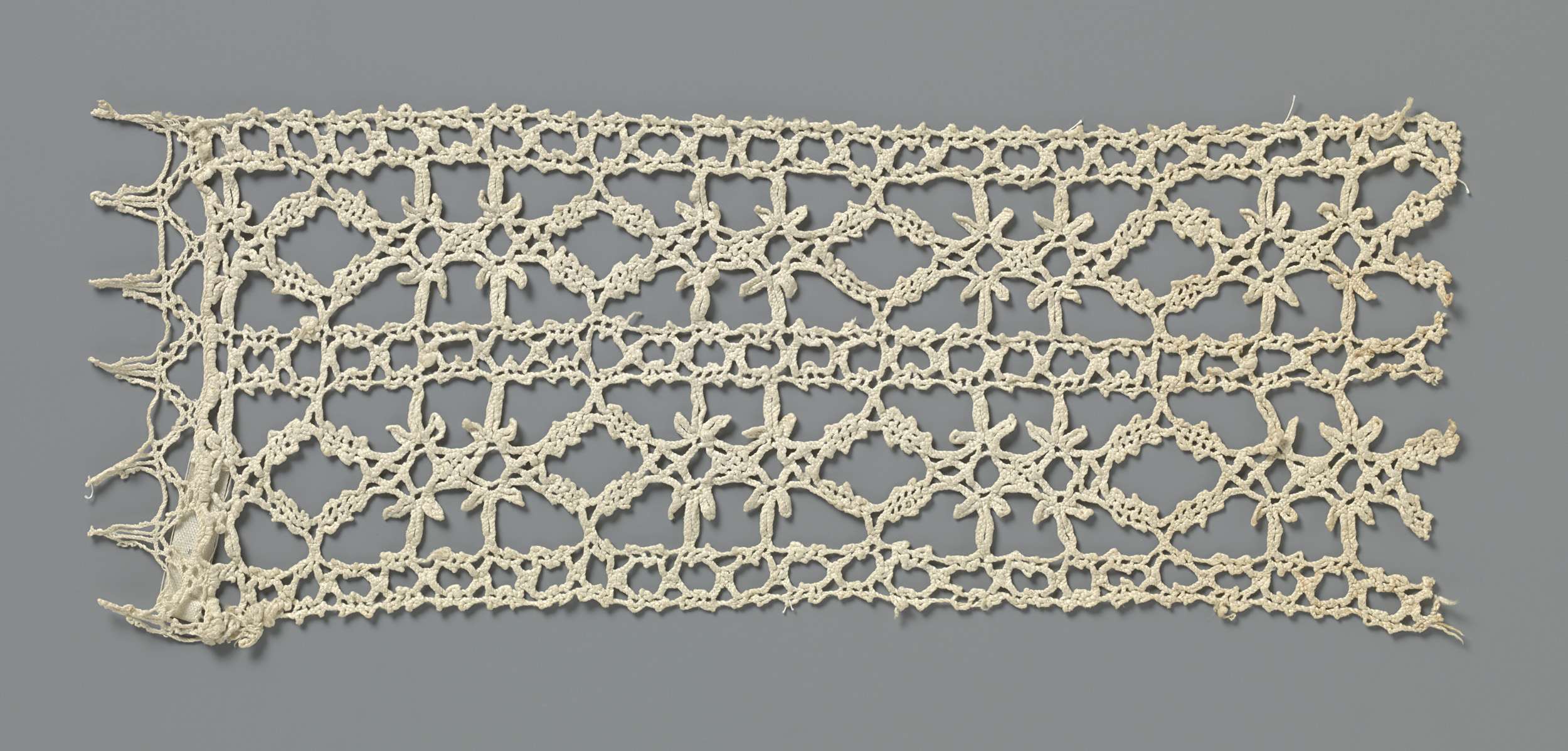 Intricate lace work featuring reticella pattern by unknown artist