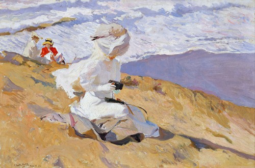 A lively scene of people enjoying a sunny day at the beach, painted by Joaquín Sorolla.