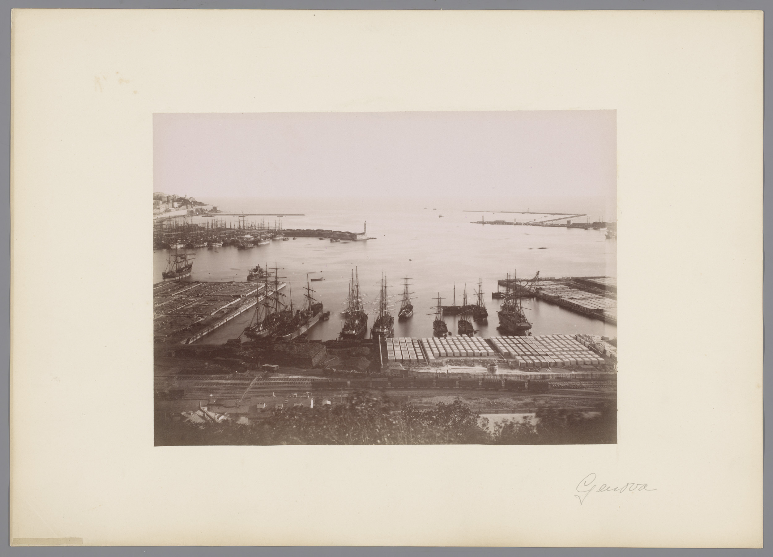 Harbor scene with boats and sunset, albumen print by Alfredo Noack