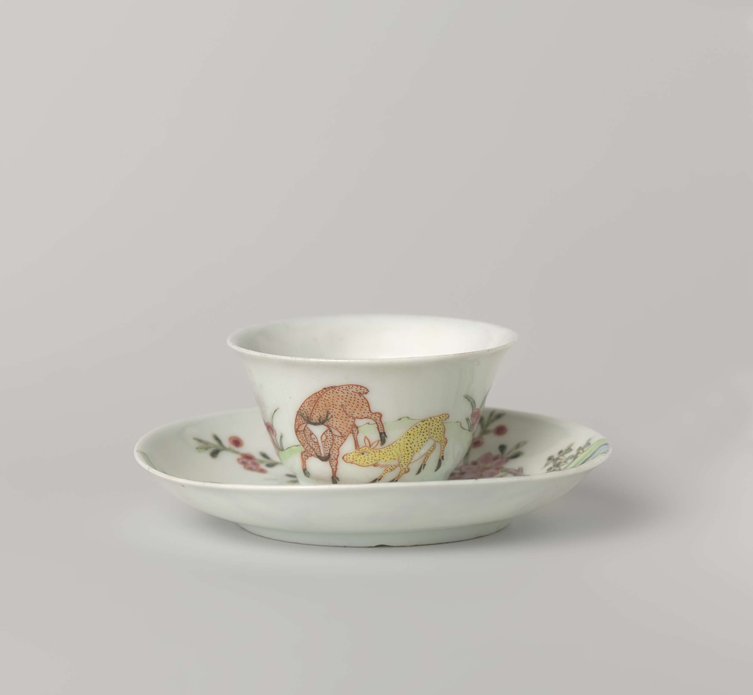 Bell-shaped cup and saucer with two deer in a landscape, unknown artist