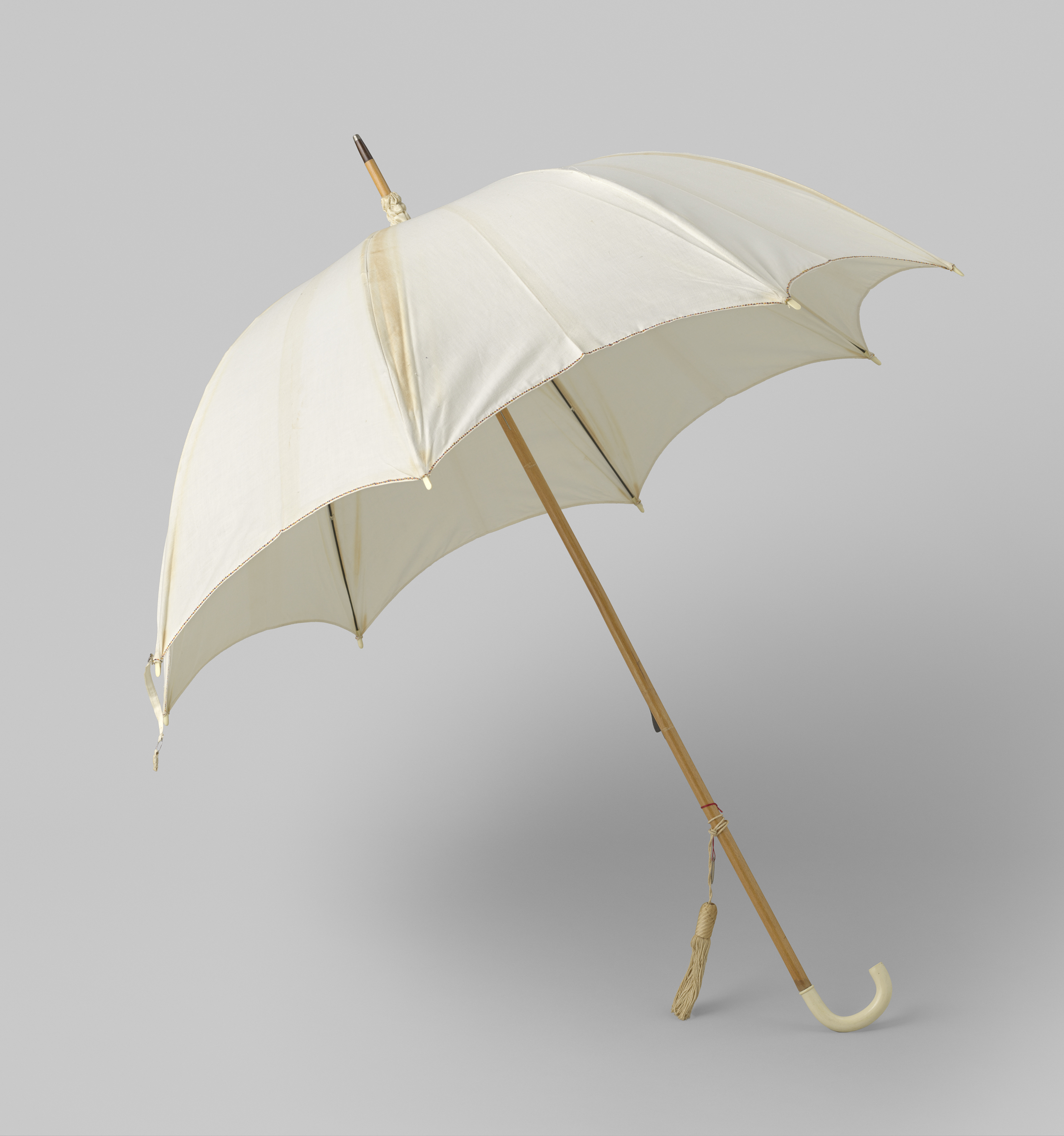 Parasol crafted by Gustav Schnitzler, featuring ivory handle and intricate detailing.