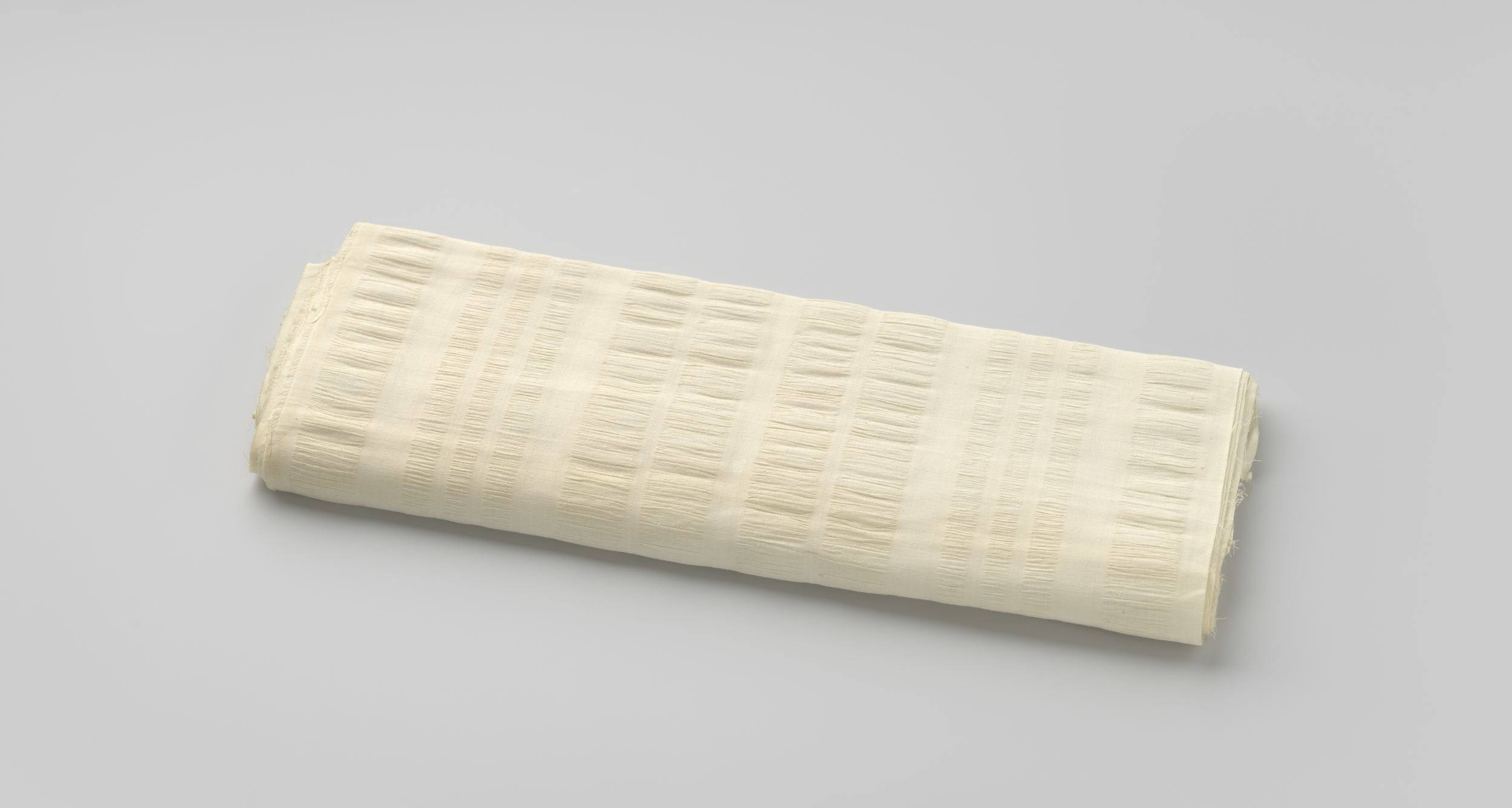 Textile work by Gustav Schnitzler featuring crêpe and smooth weaving patterns.