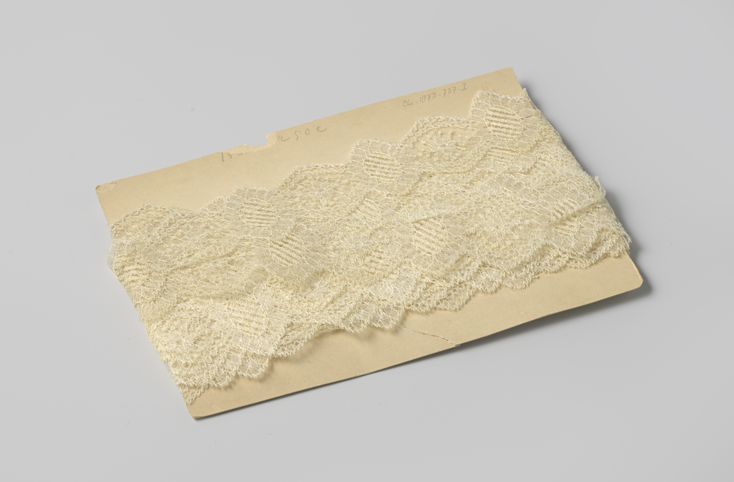 Sculpted white lacework on cardboard by Gustav Schnitzler