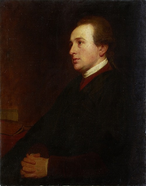 A portrait of a young man at his desk by George Romney.