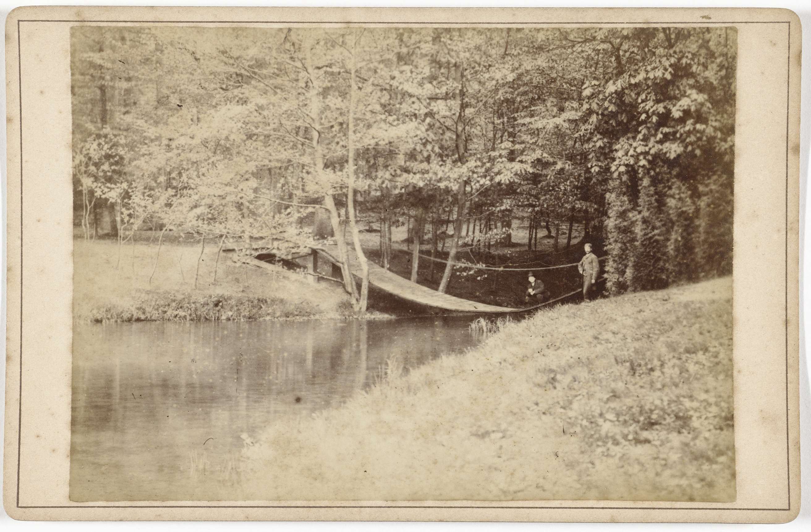 Garden landscape with a bridge over water, albumen print by J.S.J. de Jongh