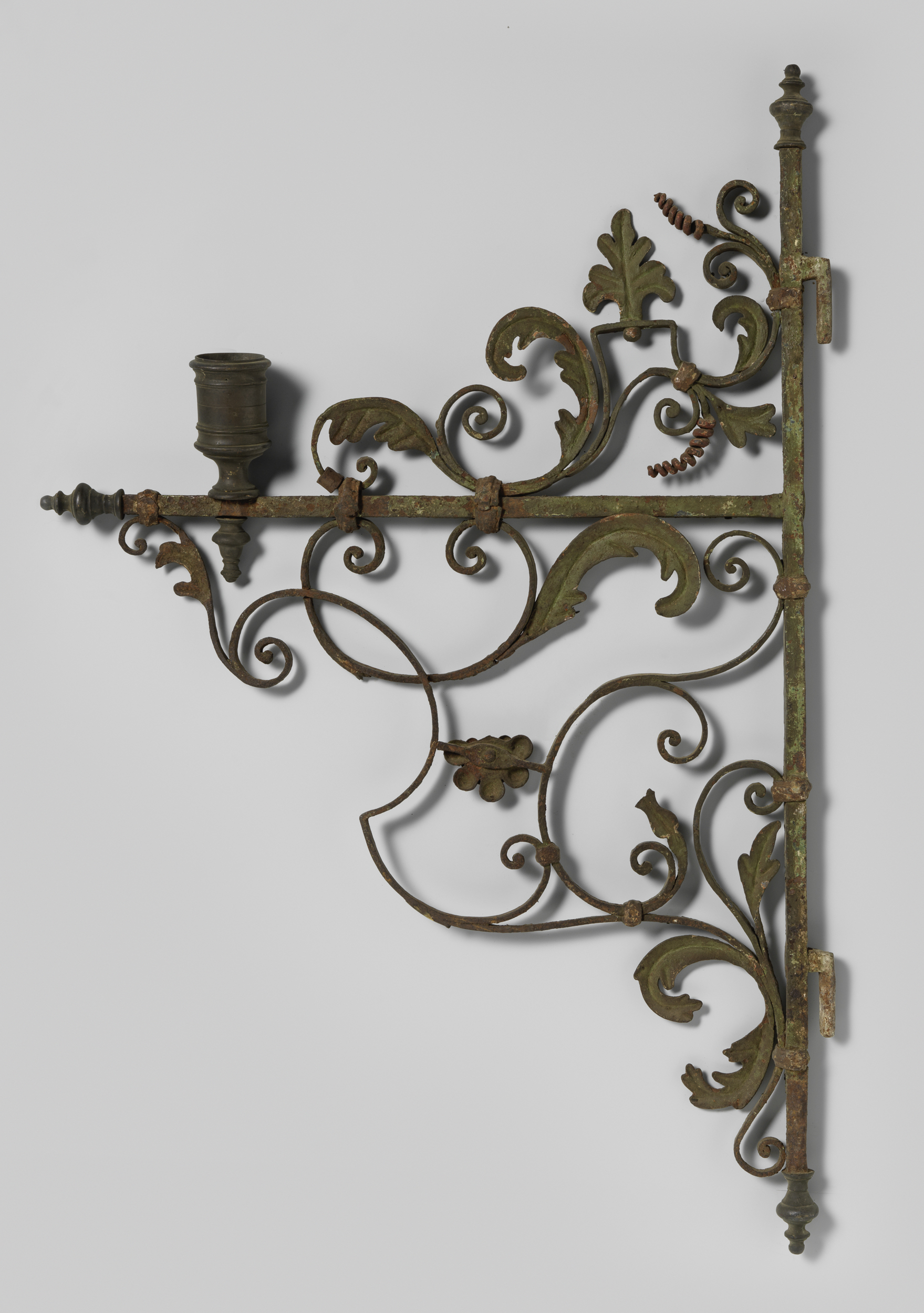 Figurative metal work by an unknown artist, featuring light and shadow interplay.