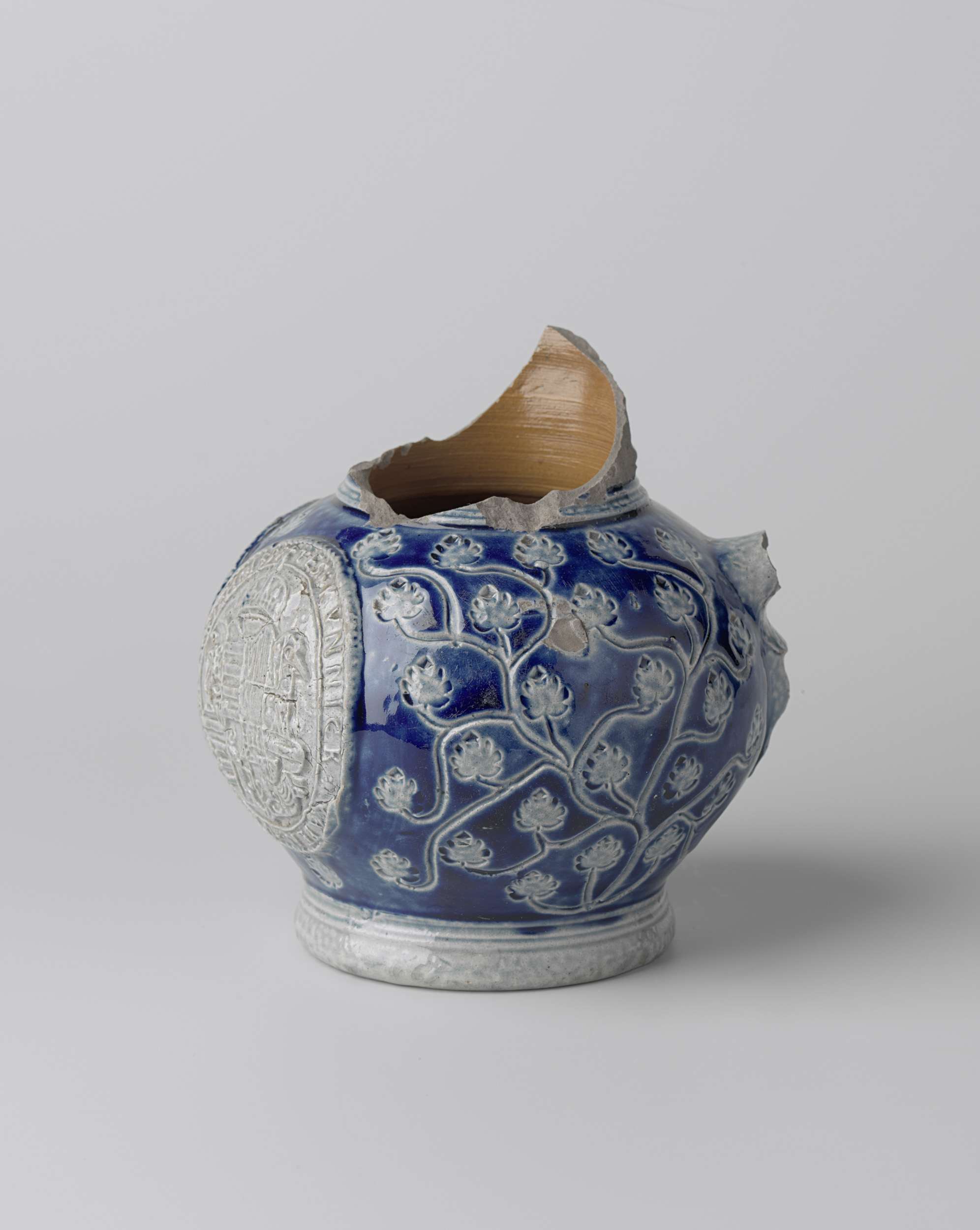 Fragment of a jug with coat of arms and floral scrolls, unknown artist