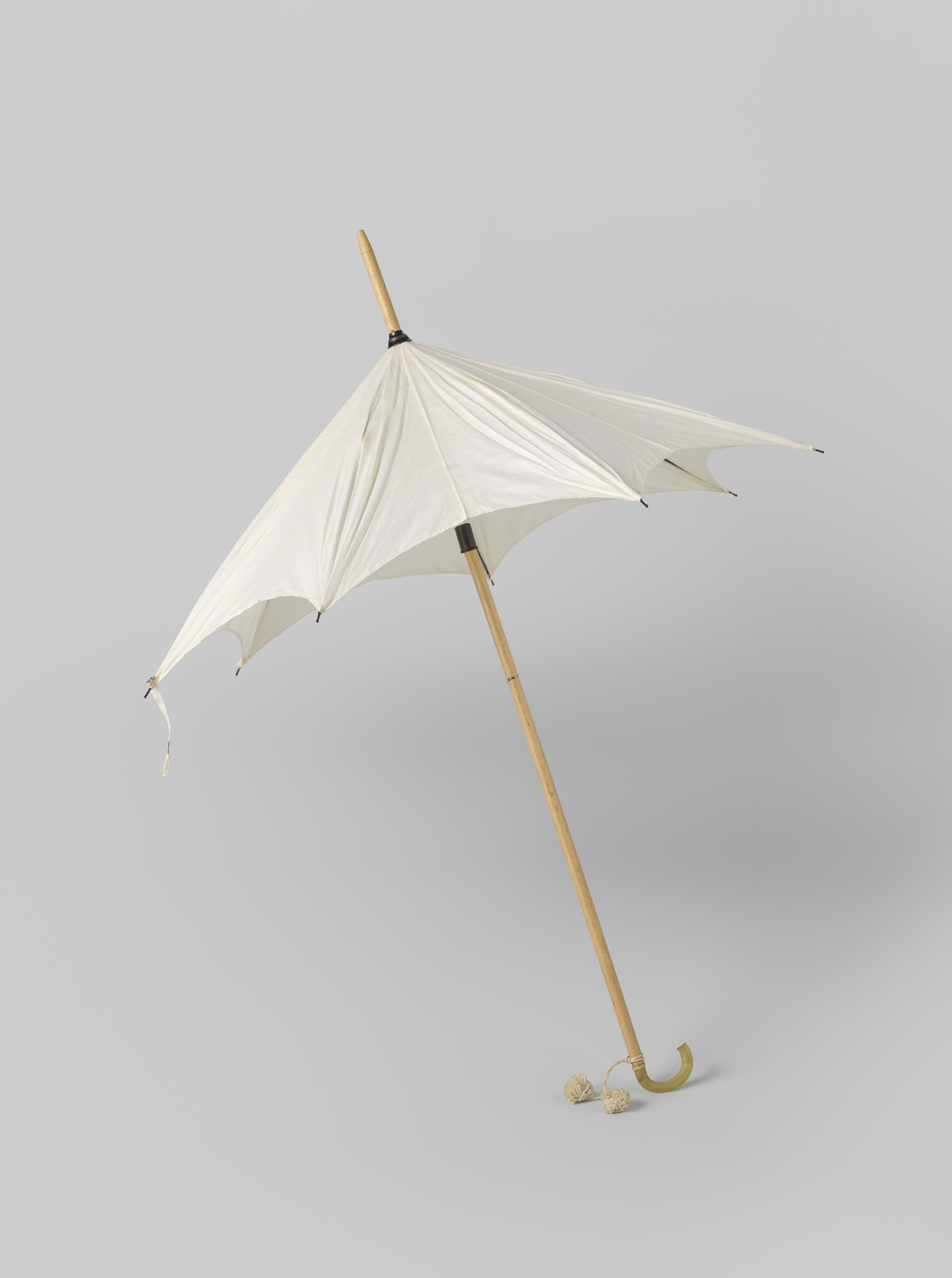 Parasol with white cotton cover on a light wooden stick by Gustav Schnitzler