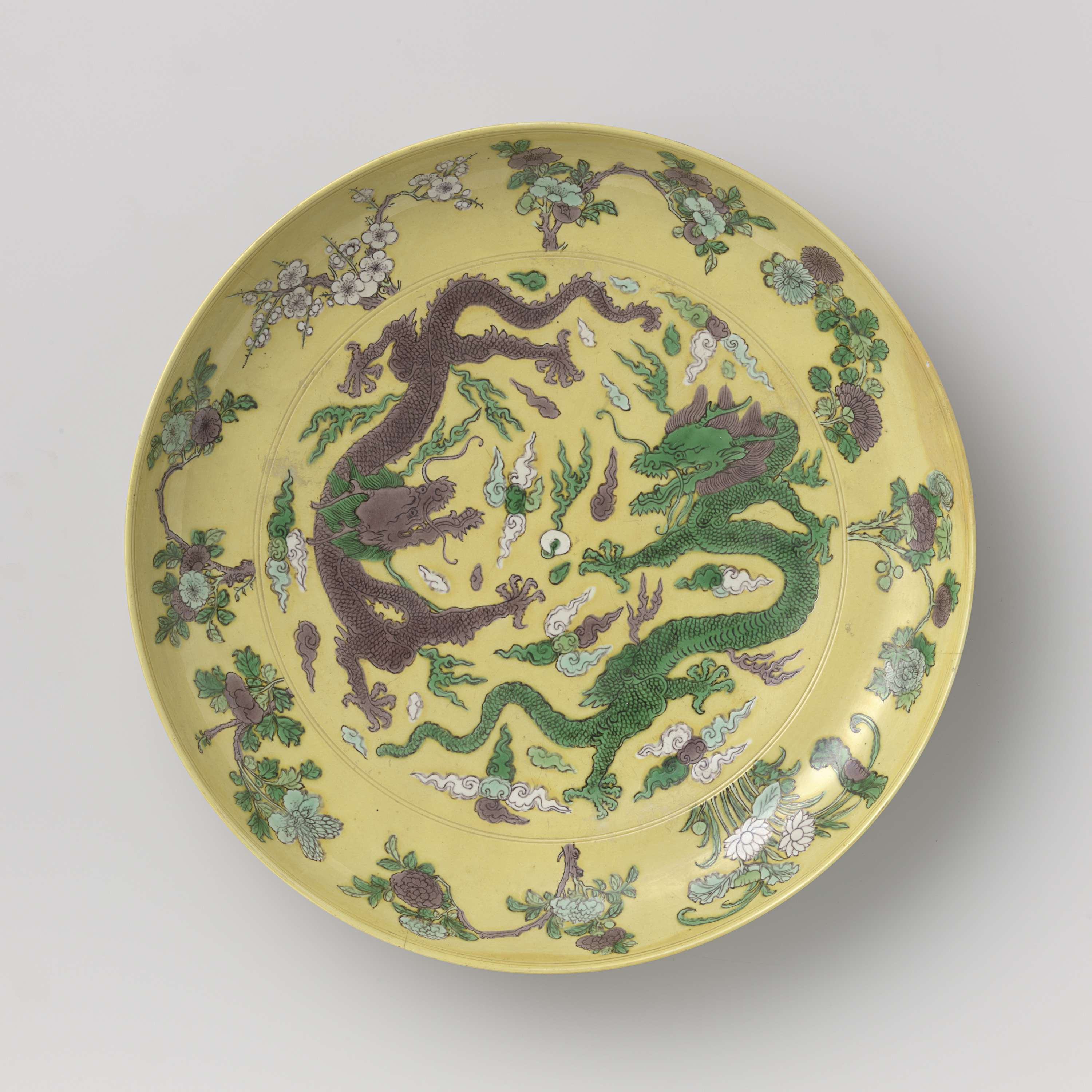 Ceramic saucer-dish with intricate dragons and pearls by Unknown Artist