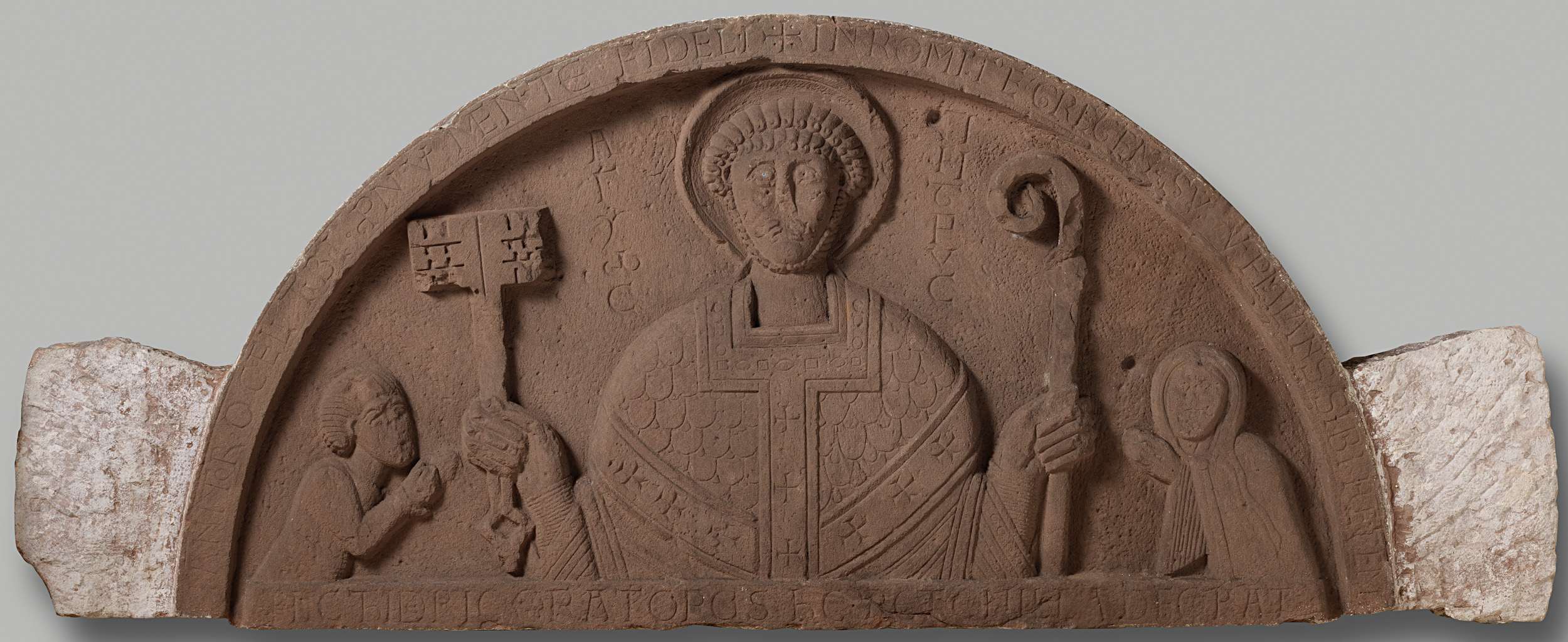 Tympanum in stone depicting Petronella and Count Dirk VI addressing the apostle Peter.