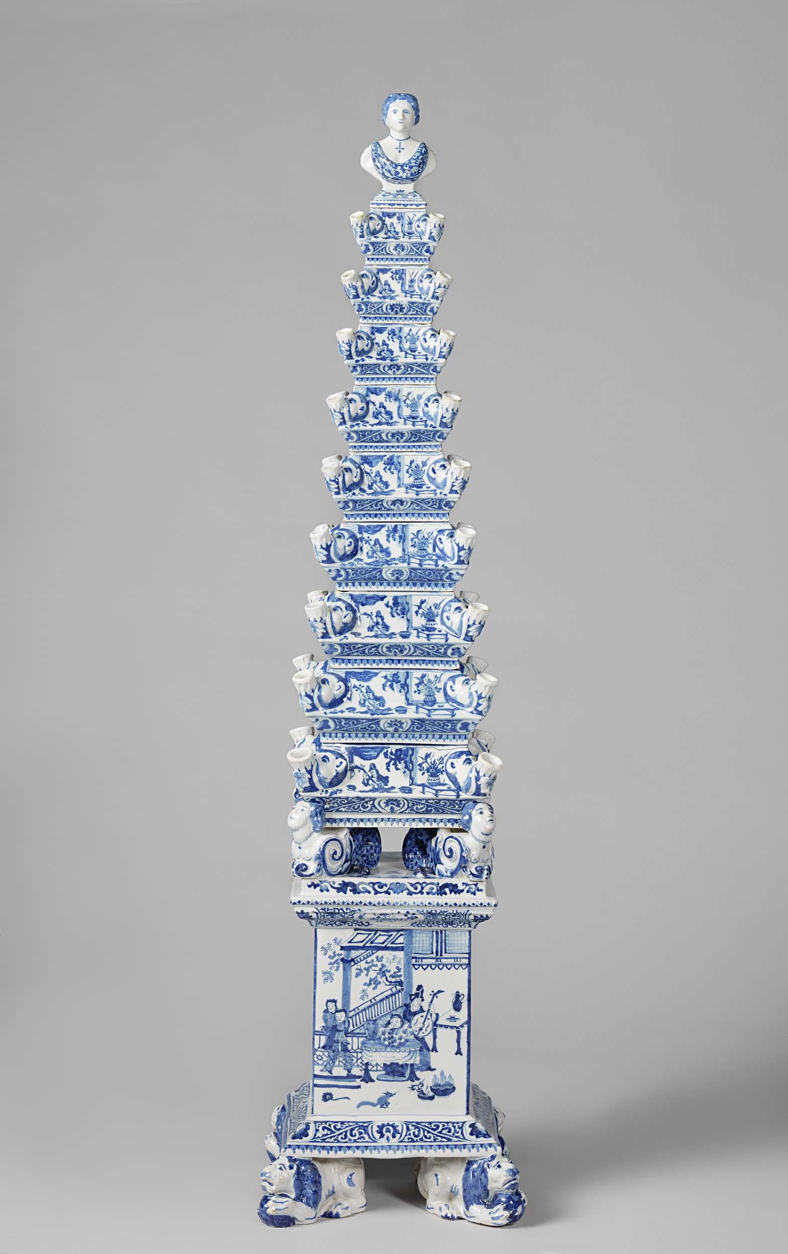 Flower pyramid by De Metaale Pot, paint medium, featuring a stacked vase with flowers.