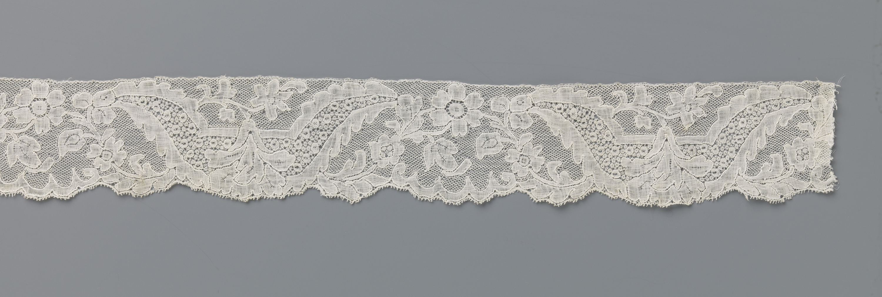Lace work featuring floral motifs by Unknown Artist