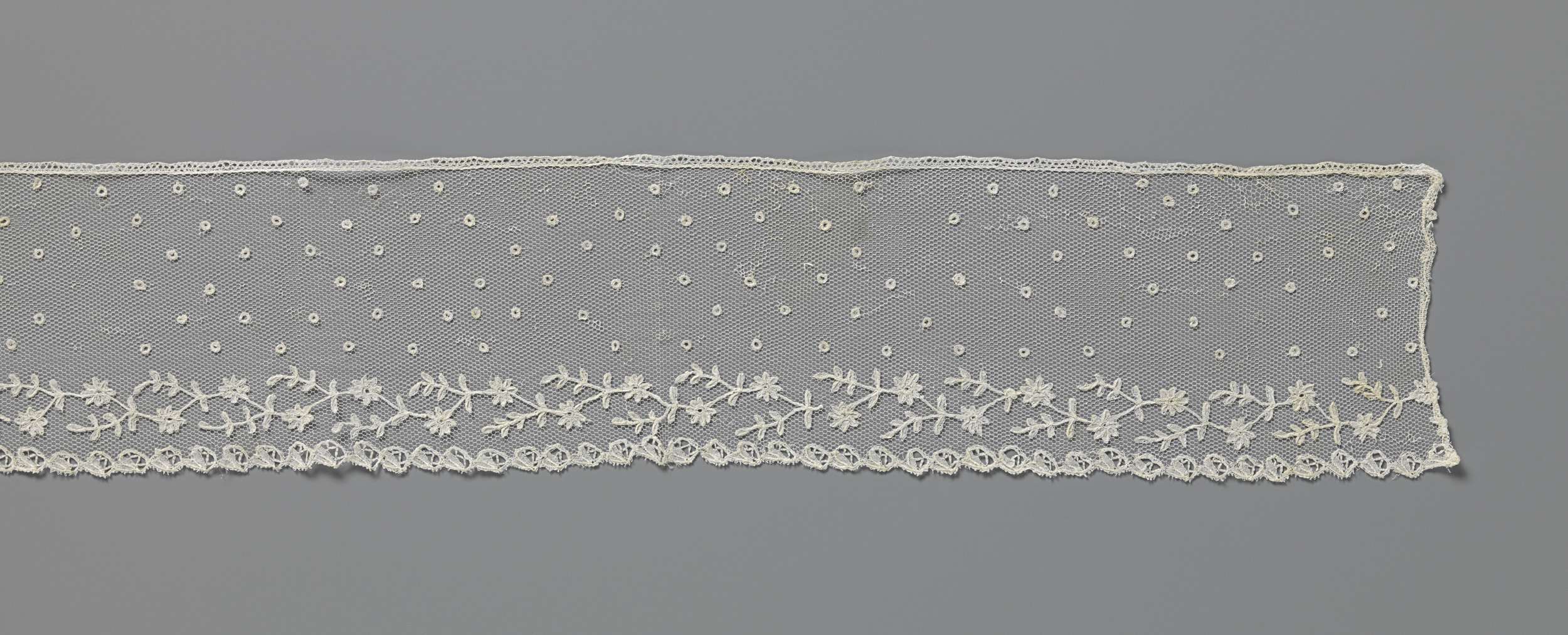Lace work featuring floral motifs by Unknown Artist